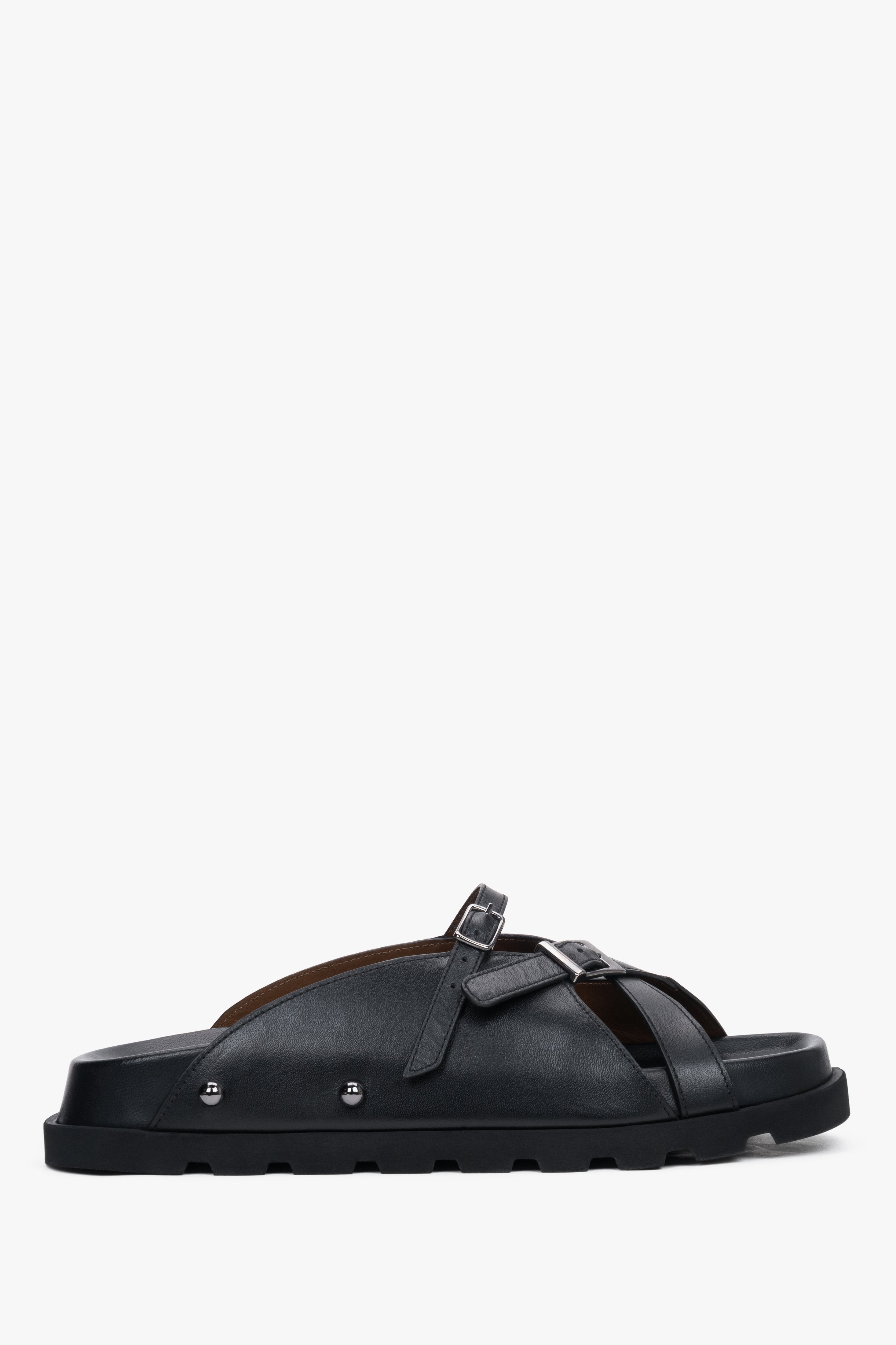 Side view of women's black leather slide sandals by Estro