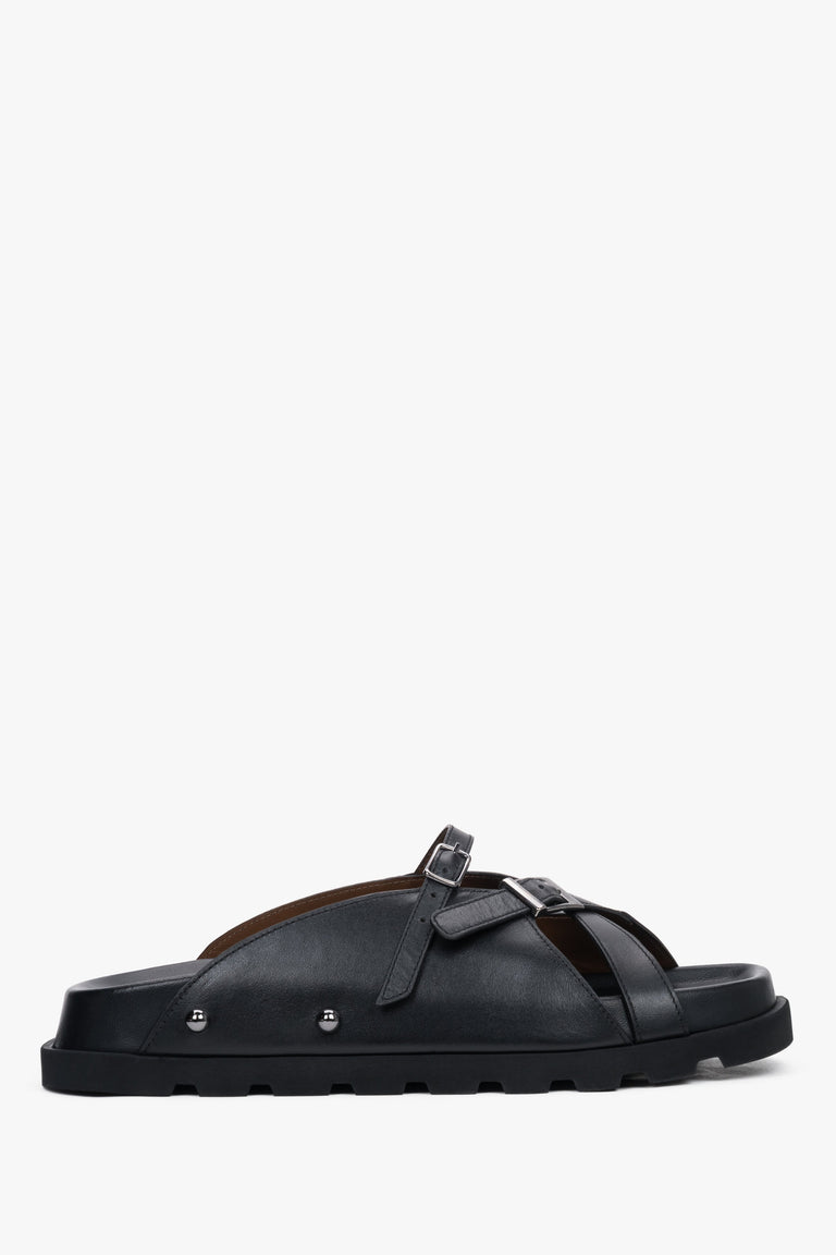Side view of women's black leather slide sandals by Estro