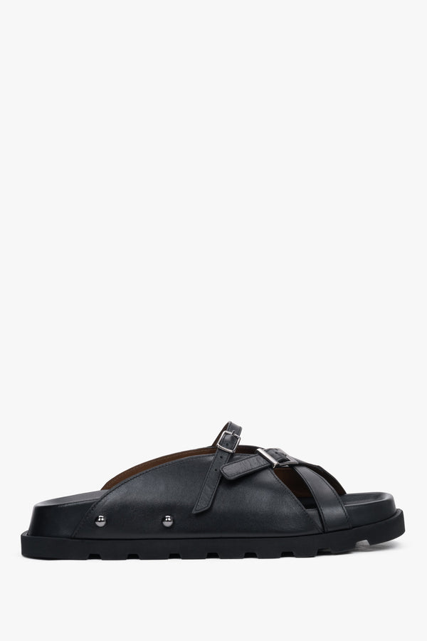 Side view of women's black leather slide sandals by Estro