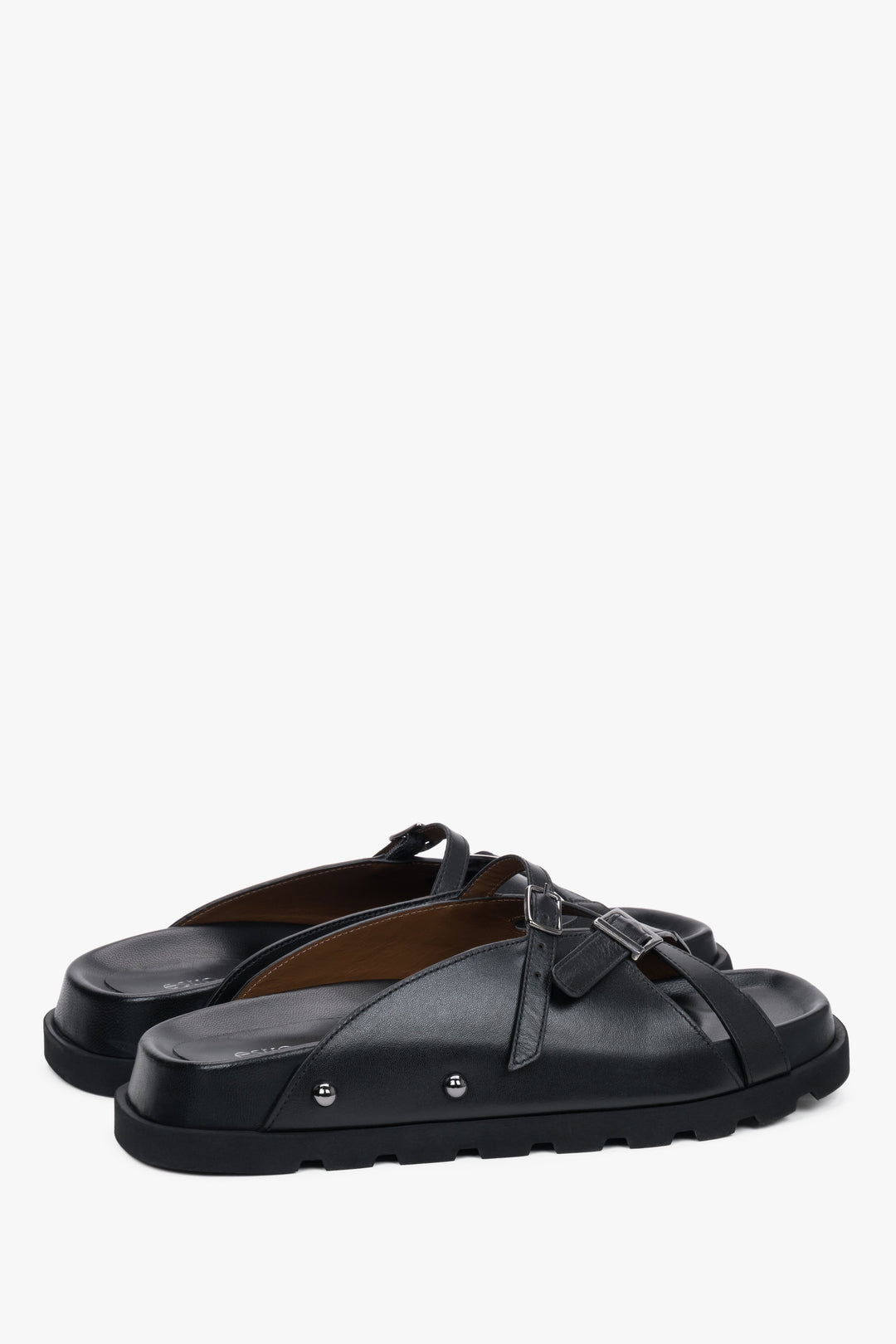 Women's black leather slide sandals with crossing straps and silver buckles