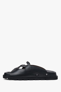 Low side view of women's black leather slide sandals by Estro