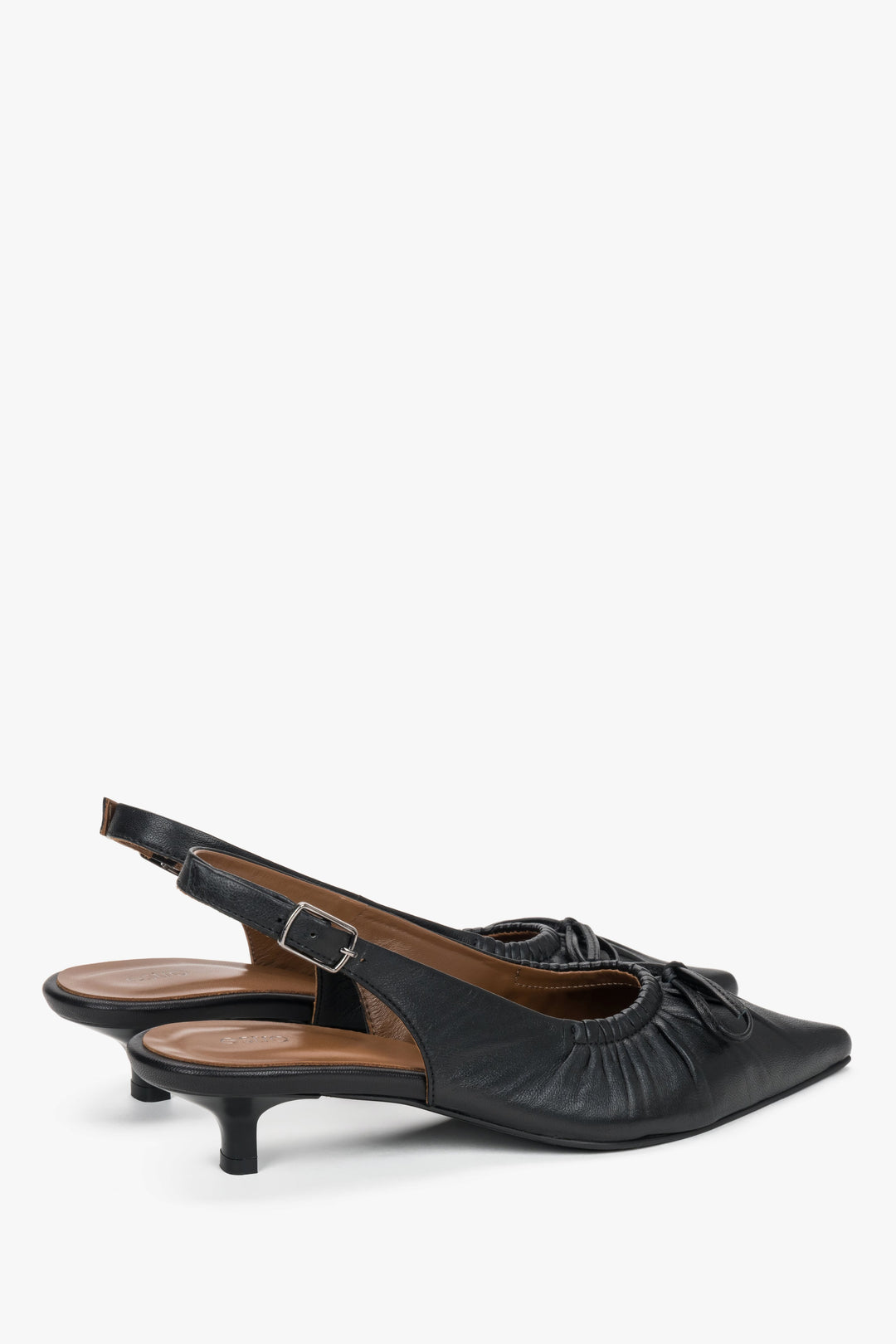 Women’s black slingback pumps by Estro made of genuine leather with a kitten heel.