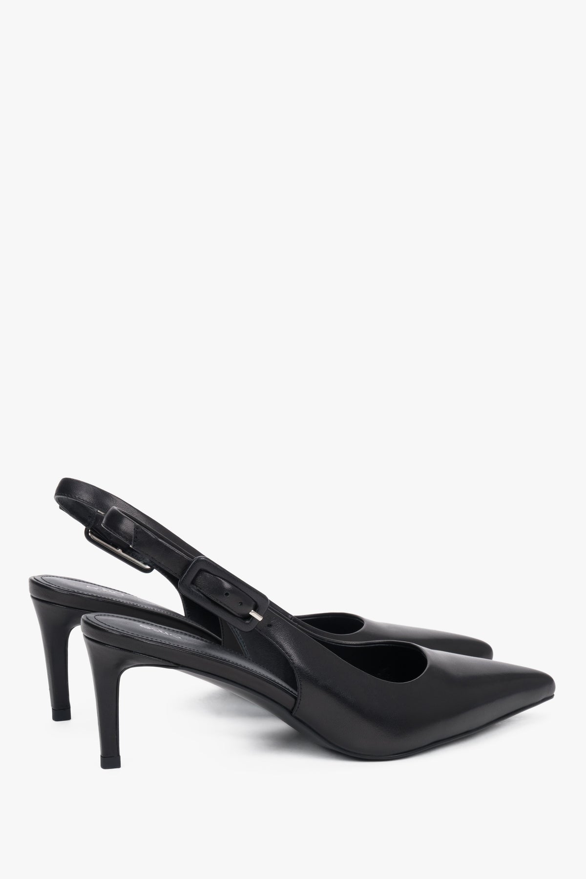 Close-up of the pointed toe and silver hardware on premium black leather pumps.