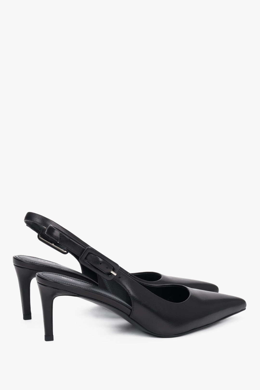Close-up of the pointed toe and silver hardware on premium black leather pumps.