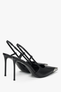 Back profile of women's black leather slingback stilettos with slim heel