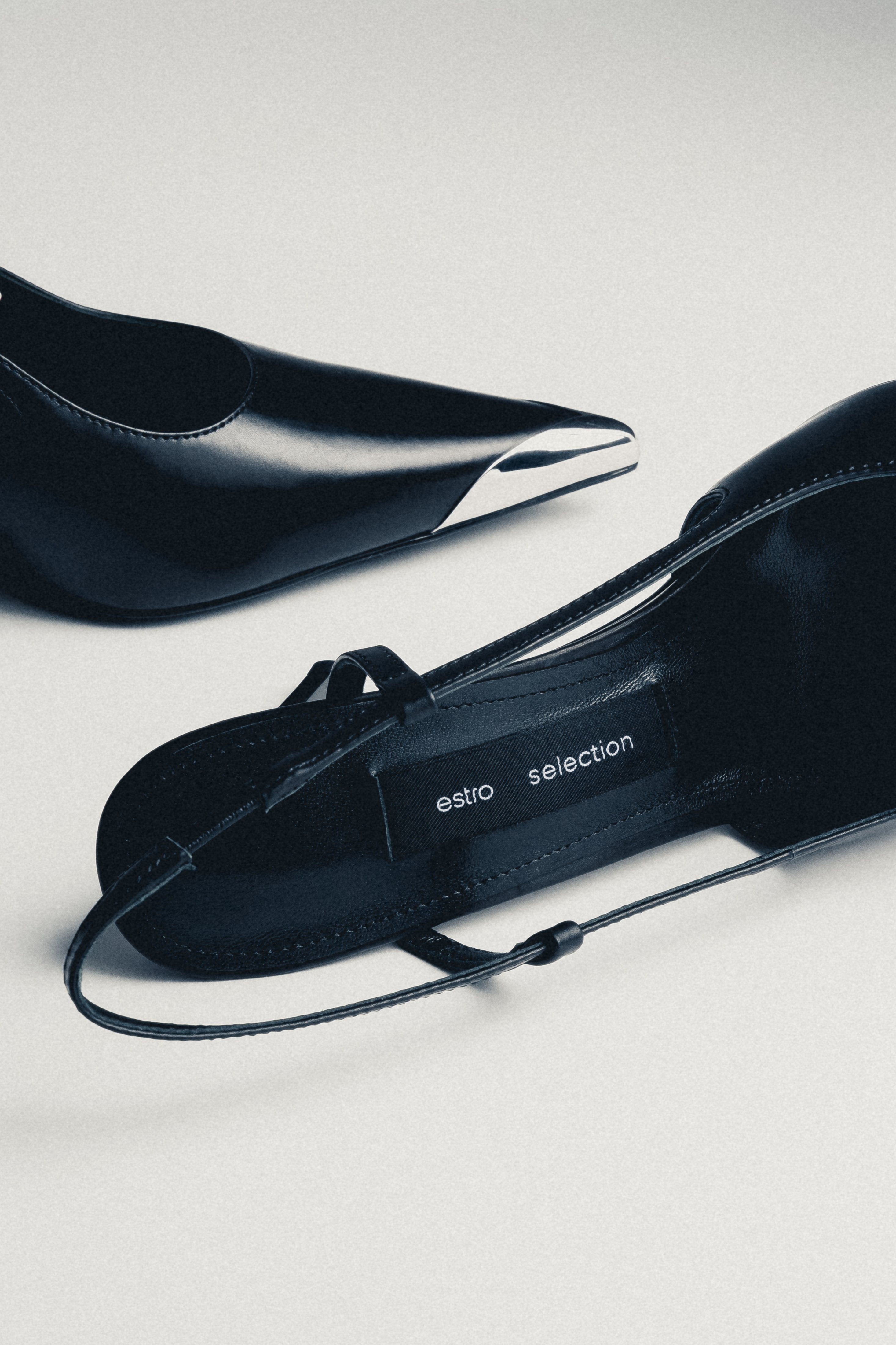 Pair of women's black leather slingback heels by Estro Selection