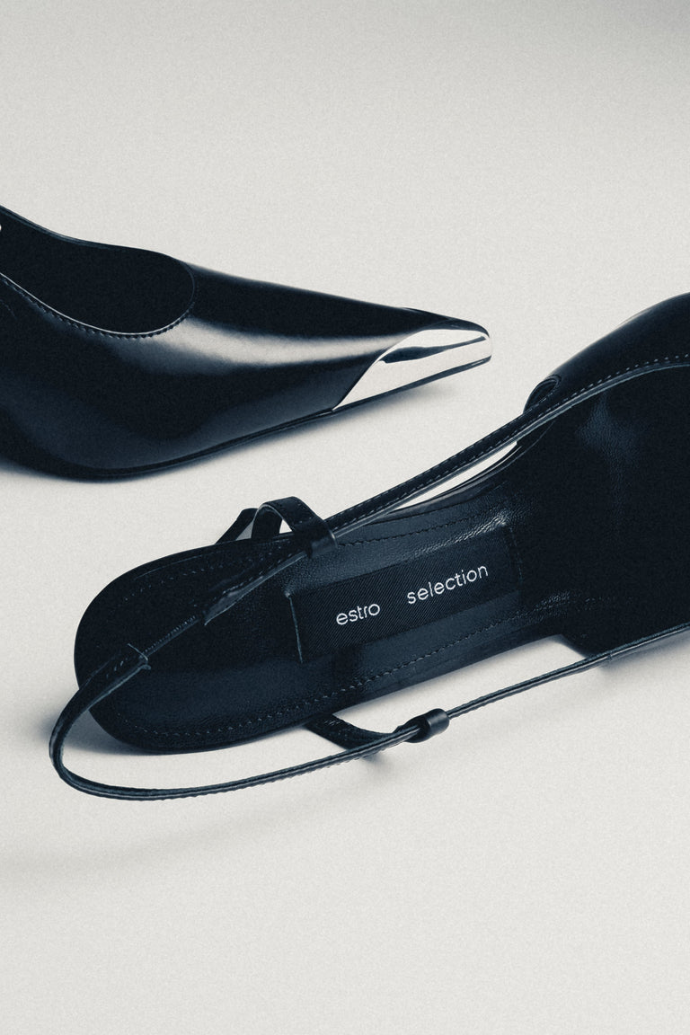 Pair of women's black leather slingback heels by Estro Selection