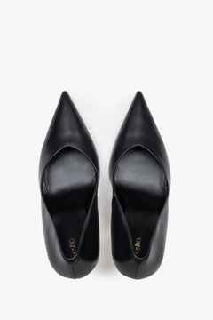 Black leather women's stiletto pumps by Estro, featuring a slim high heel and a pointed toe.