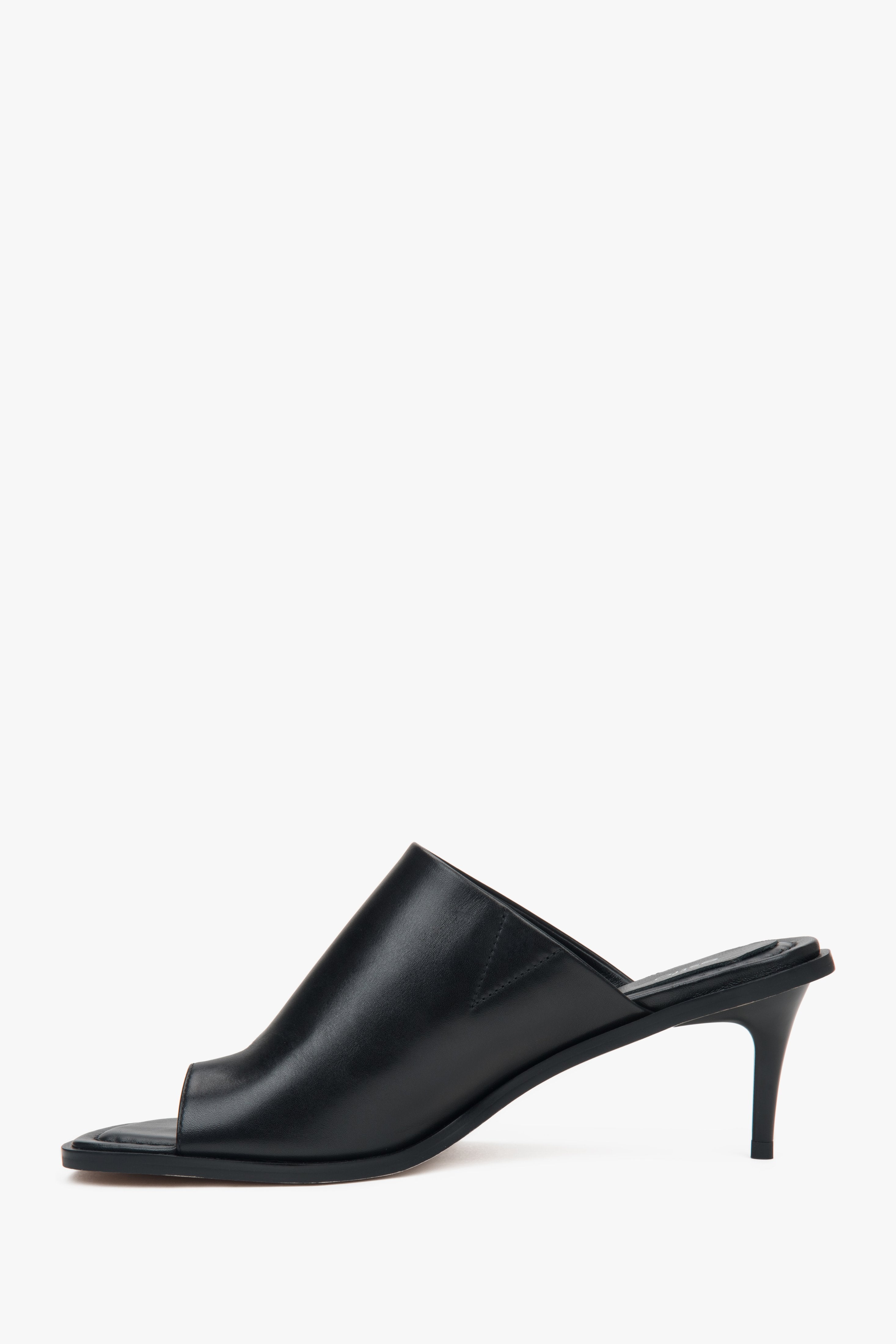 Estro black women’s leather stiletto mules with a toe ring.