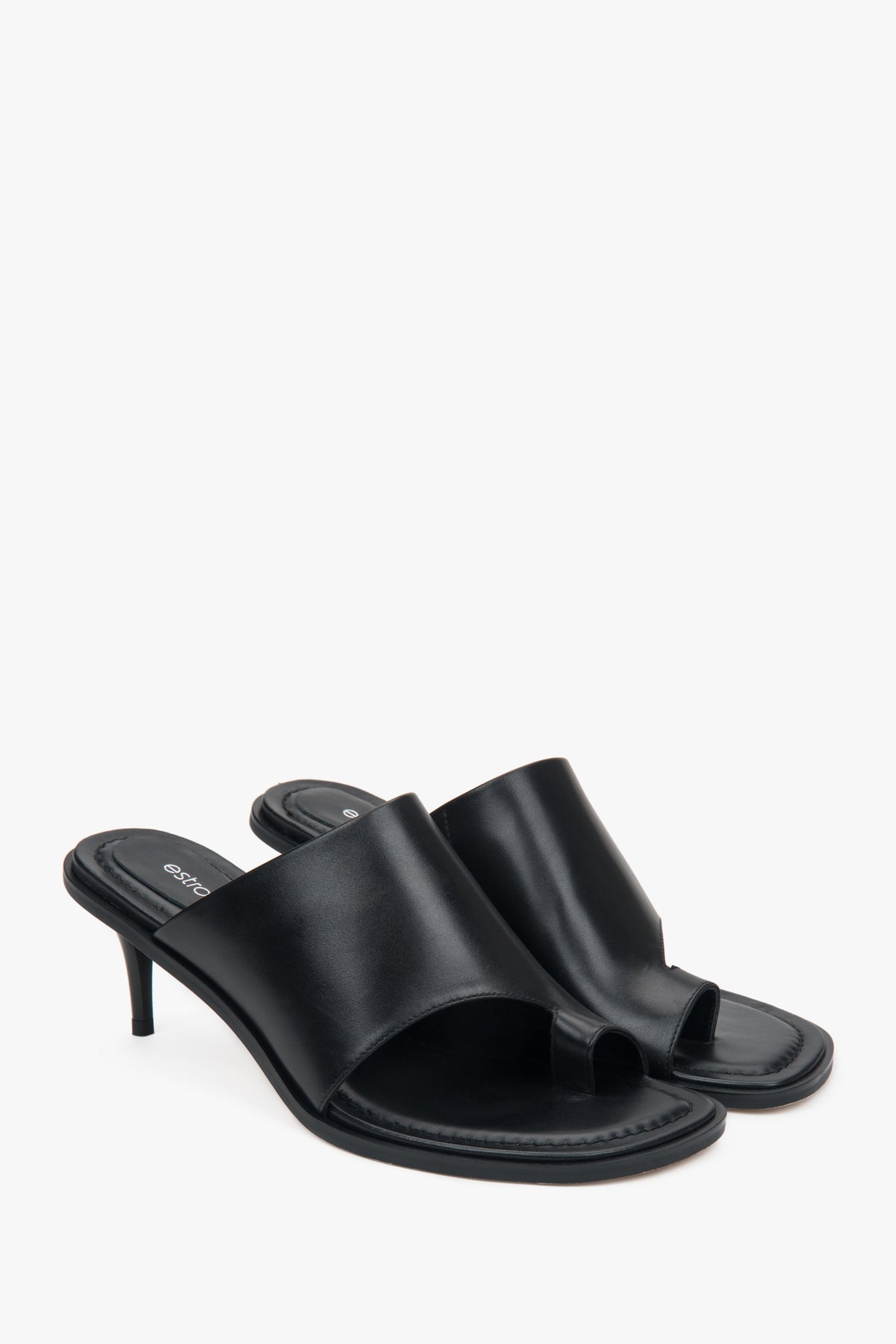 Estro women’s mules, black, leather, with a stiletto heel and a toe ring.