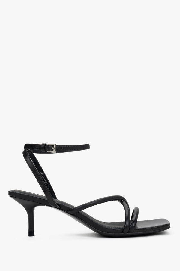 Women’s black leather stiletto sandals by Estro with thin crossing straps.