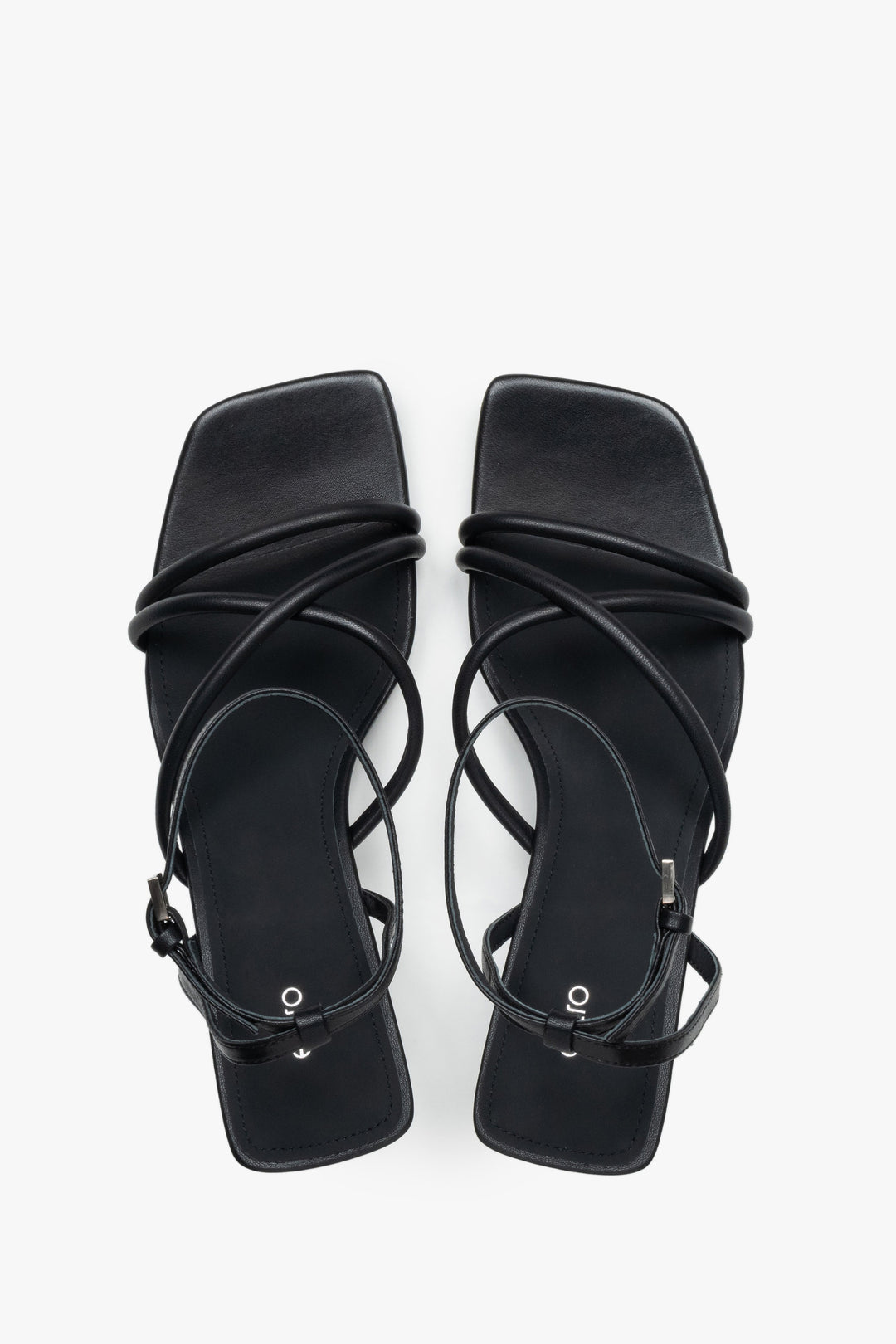 Top view of women’s black leather stiletto sandals with square toe.