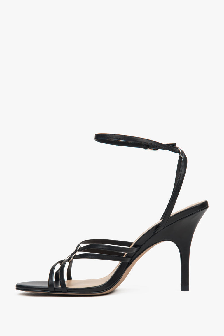 Women’s black leather stiletto sandals with silver details by Estro.