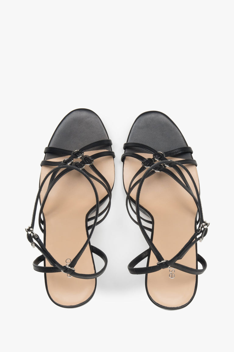 Women’s black leather stiletto sandals with silver details by Estro.