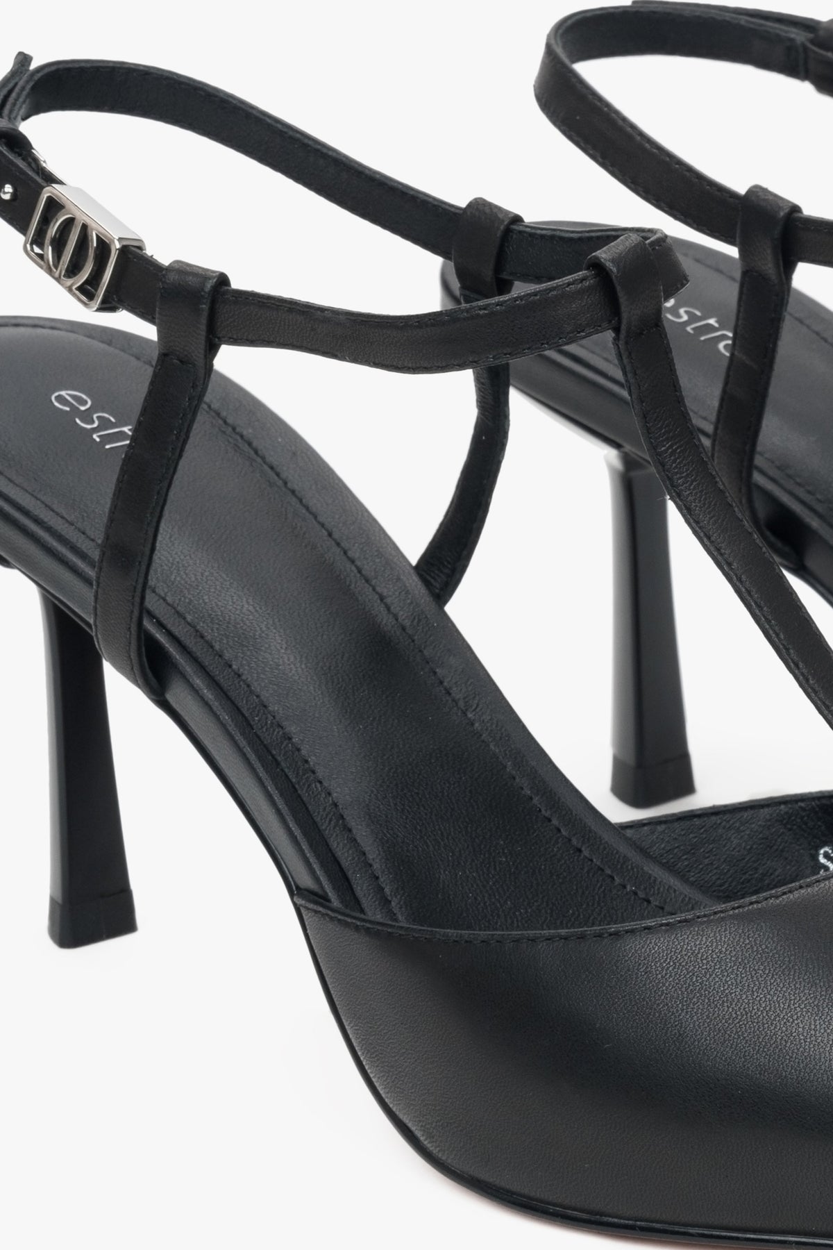 Estro women’s slingback stilettos in black leather with pointed toe.