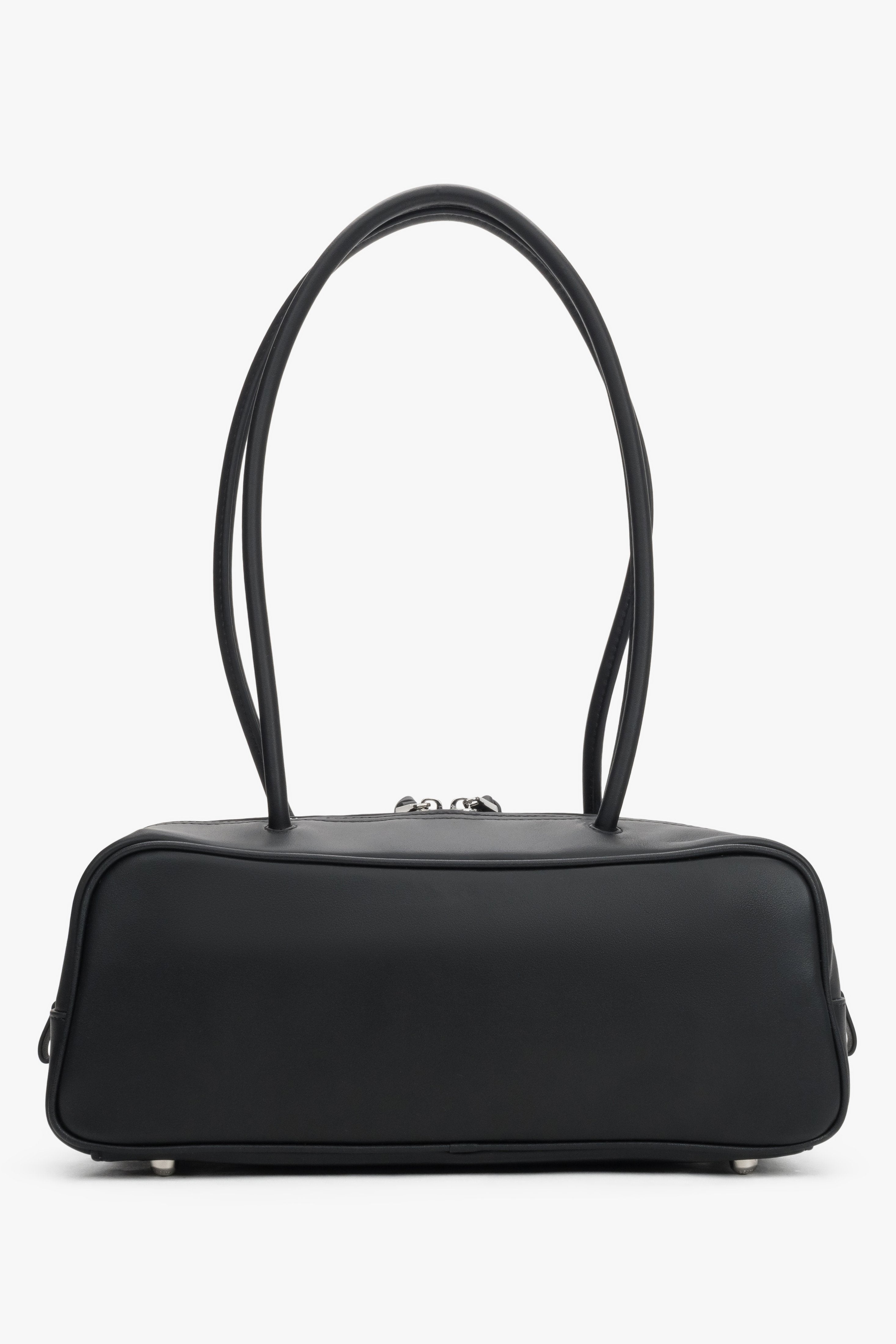 Compact structured shoulder bag in genuine leather with textile lining and tassel details.