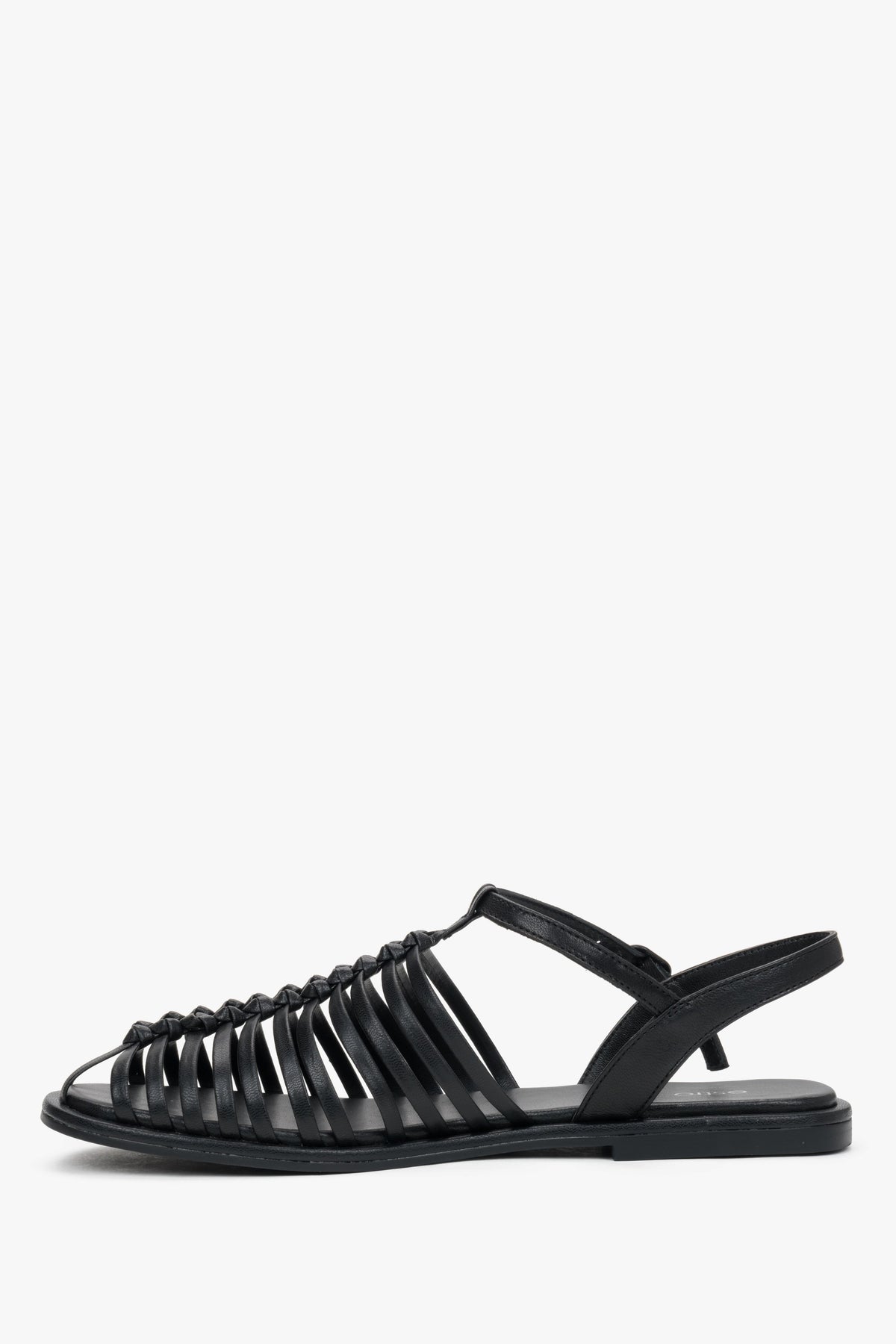 Elegant black genuine leather closed-toe sandals with a flat heel.