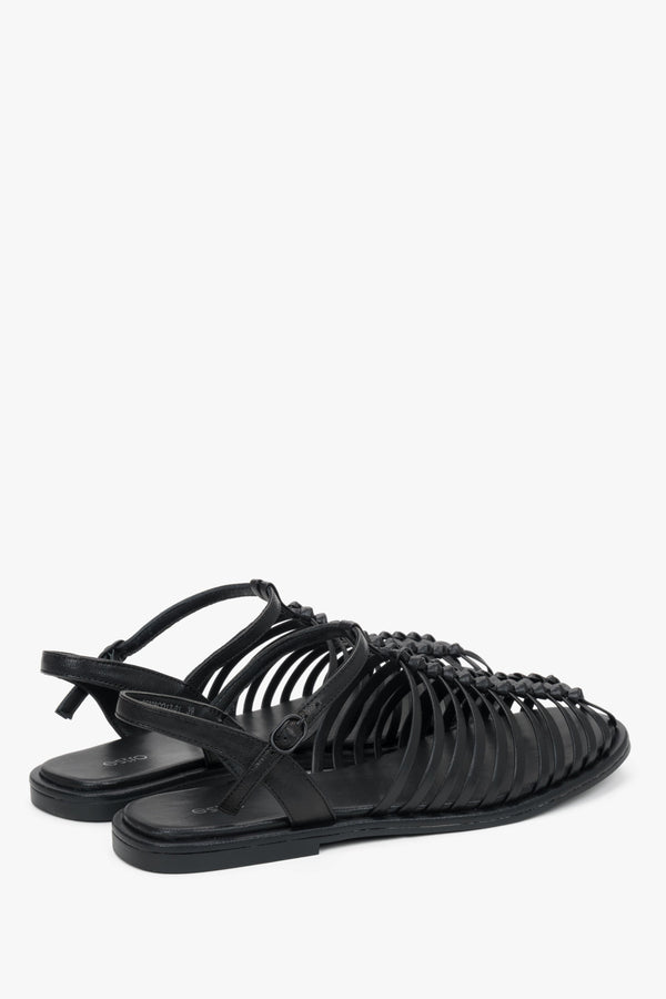 Estro black leather cage sandals with a premium chevro insole.
