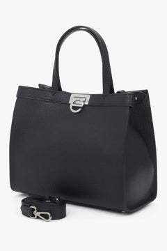 Versatile design with dual handles and an adjustable shoulder strap for comfortable wear.