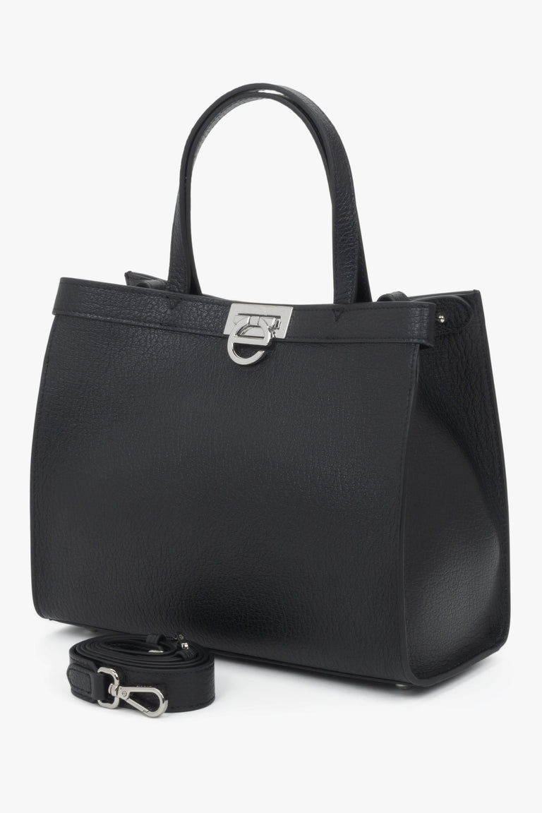 Versatile design with dual handles and an adjustable shoulder strap for comfortable wear.