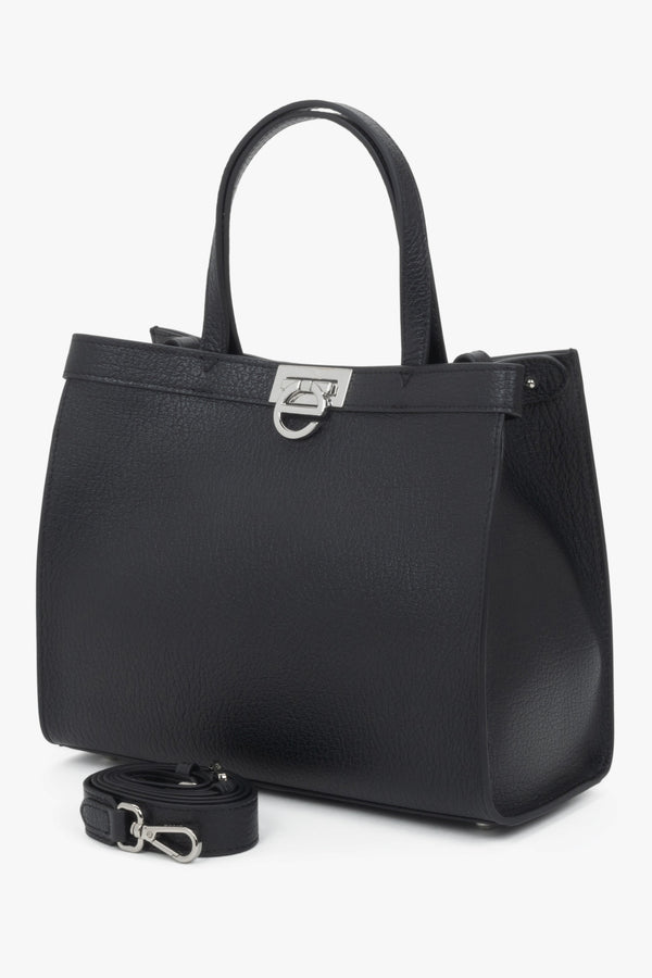 Versatile design with dual handles and an adjustable shoulder strap for comfortable wear.