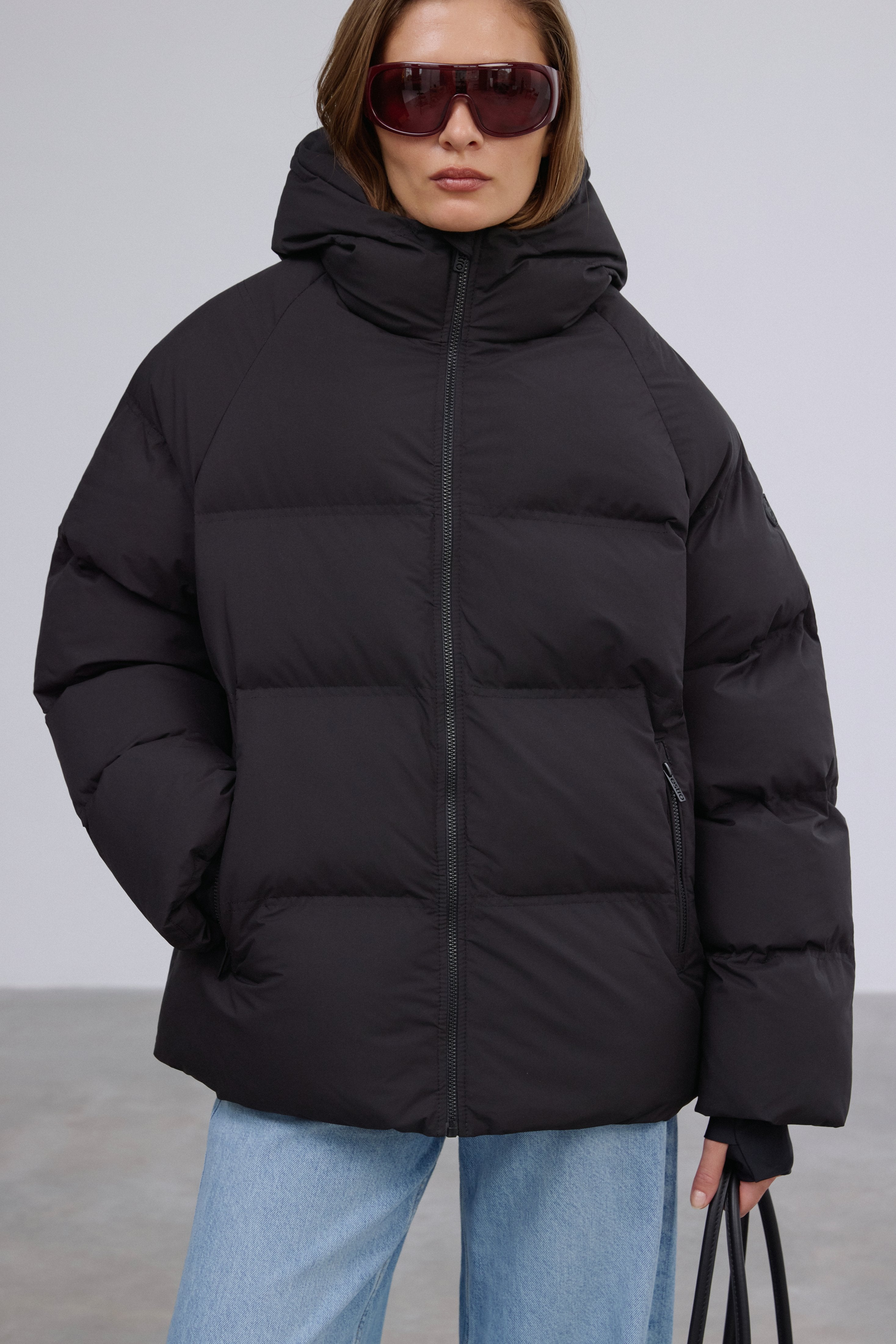 Close-up of the warm eco-down insulation and sleek black finish.