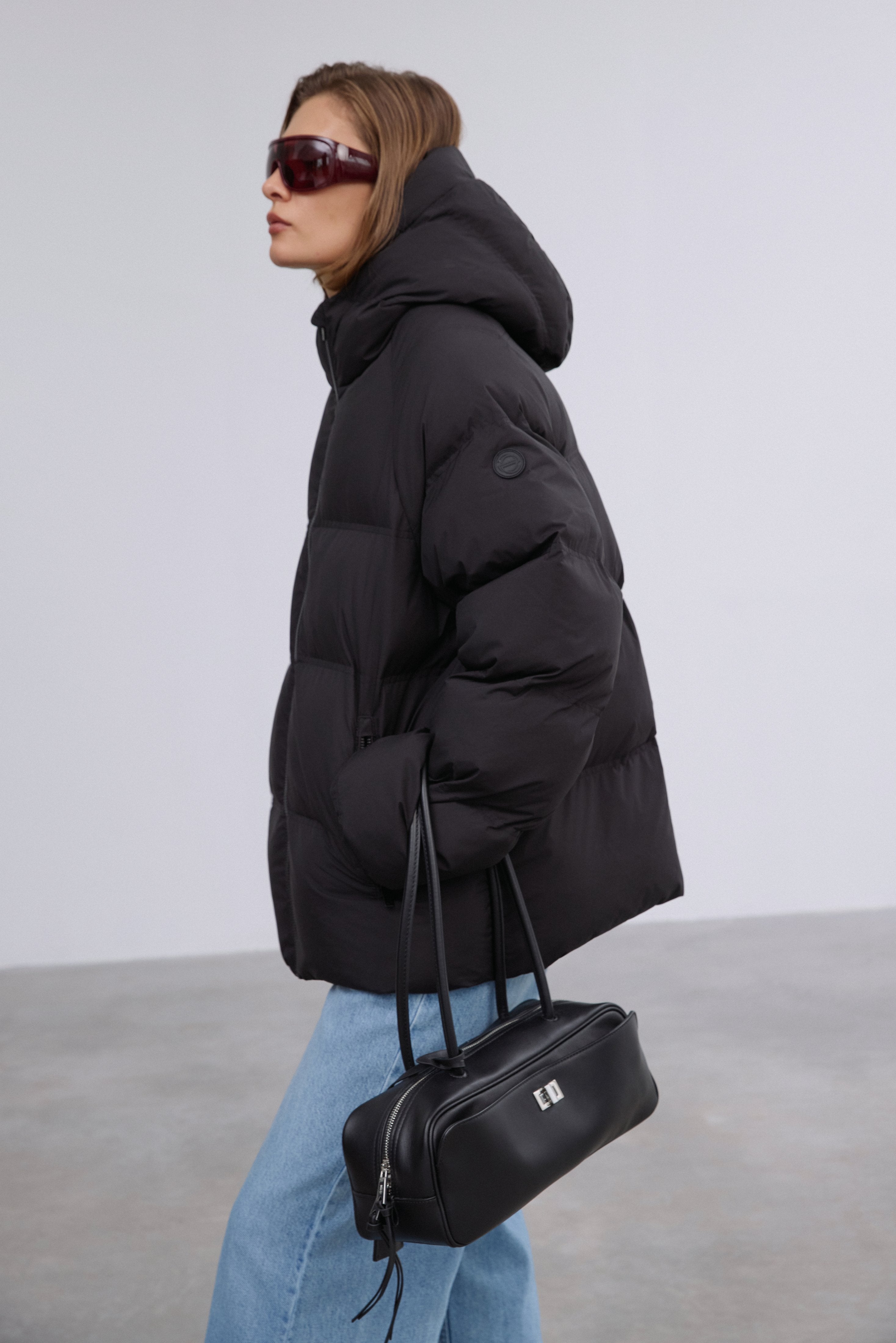 Full-length shot presenting the stylish loose-fit cut and minimalist design.