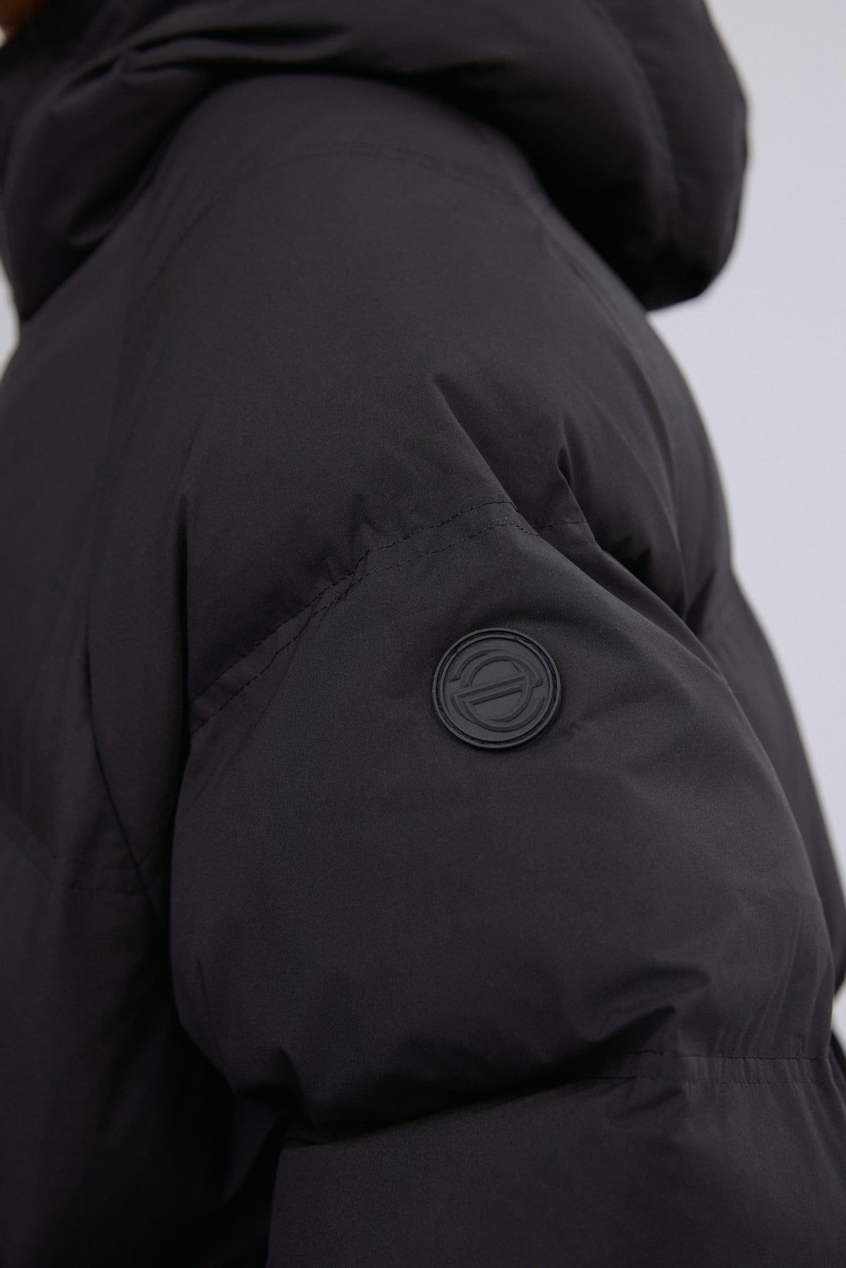 Detailed view highlighting the premium eco-down padding and fine tailoring.
