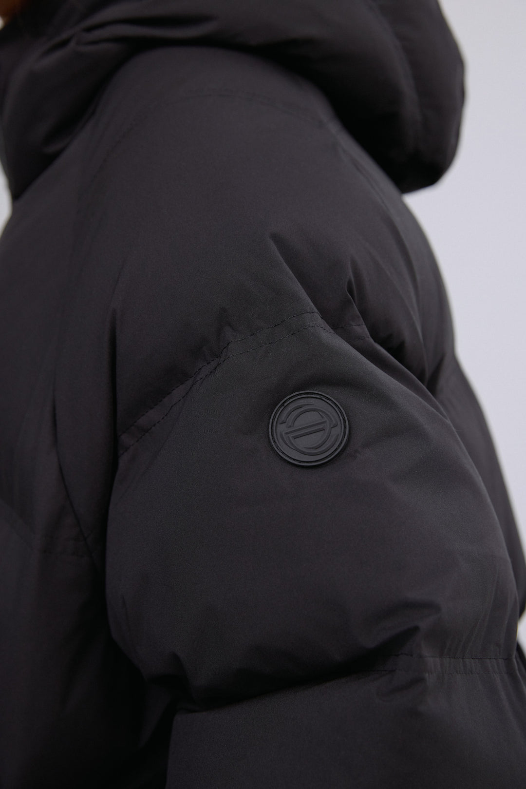 Detailed view highlighting the premium eco-down padding and fine tailoring.
