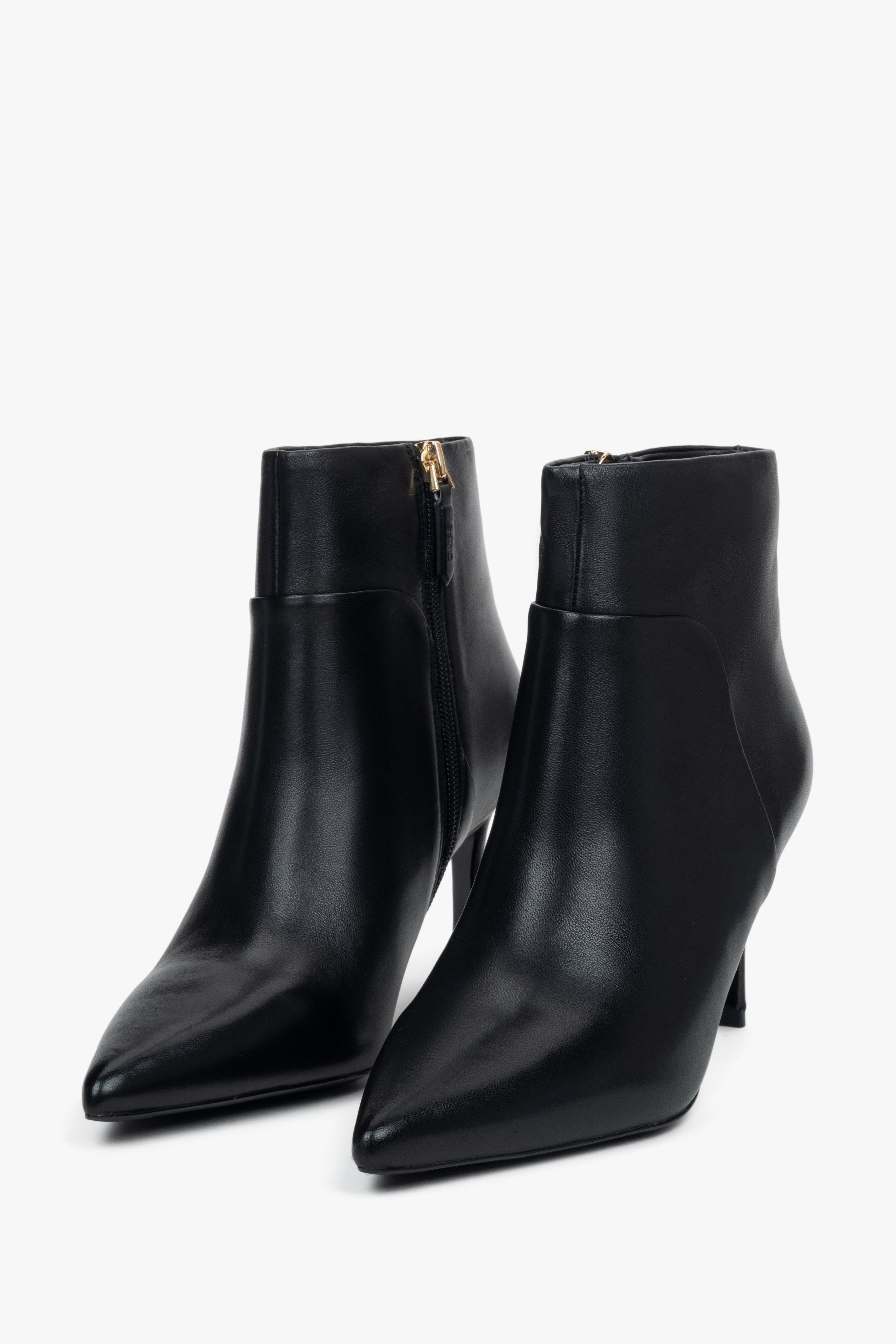 Women’s black, low ankle boots with a pointed toe on a stiletto heel Estro.
