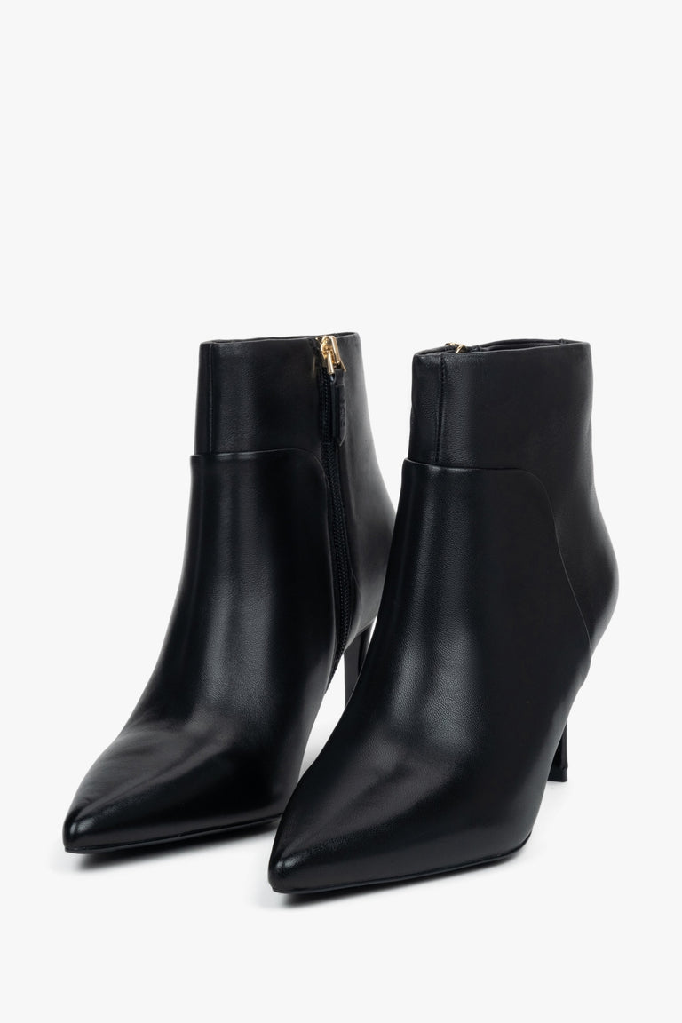 Women’s black, low ankle boots with a pointed toe on a stiletto heel Estro.
