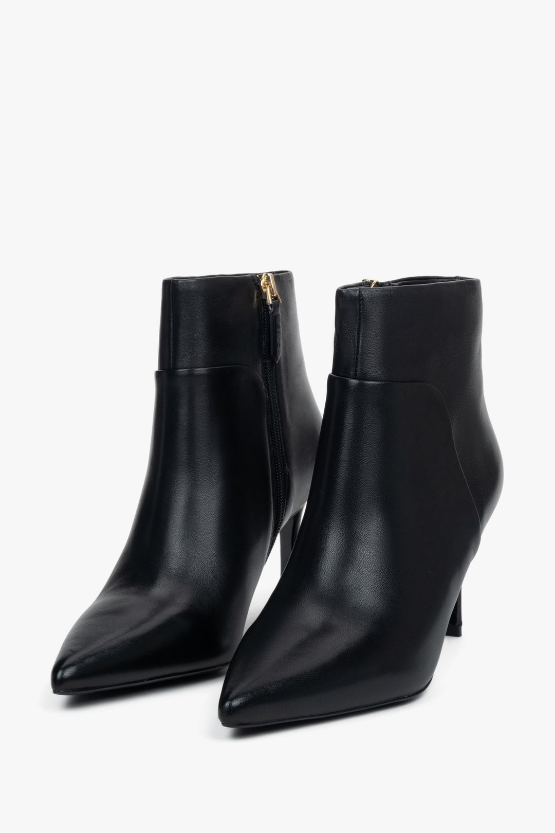 Women’s black, low ankle boots with a pointed toe on a stiletto heel Estro.
