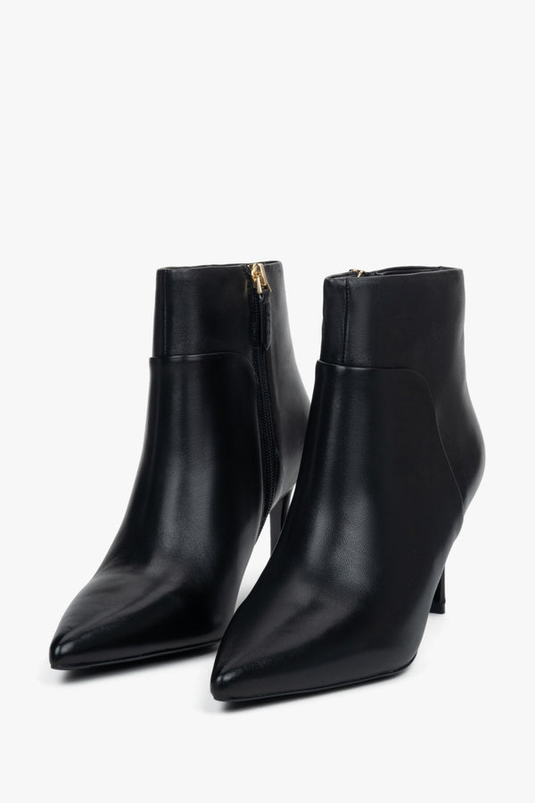 Women’s black, low ankle boots with a pointed toe on a stiletto heel Estro.
