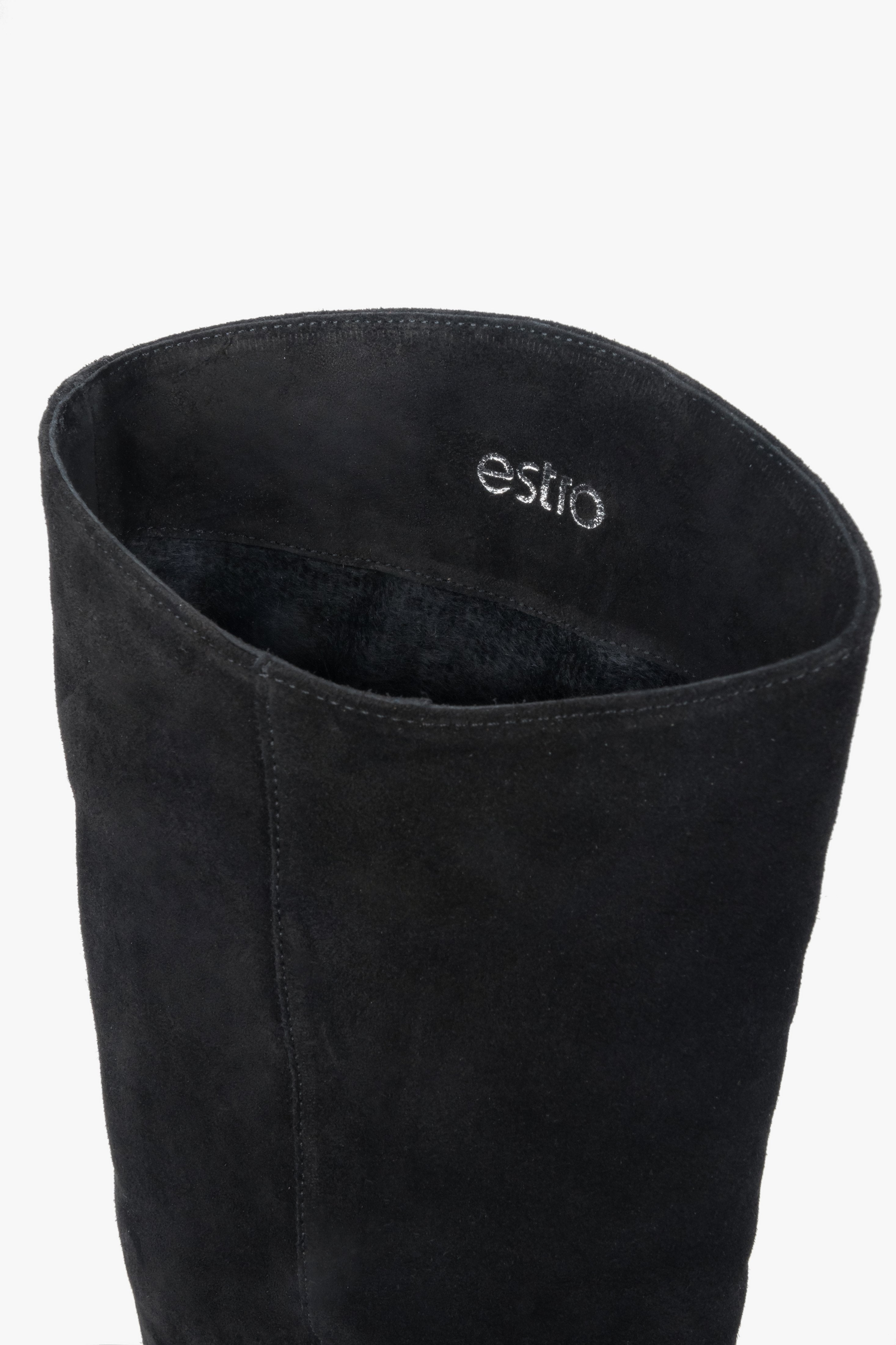 Black women’s knee-high boots made of natural velour on a low heel – details.