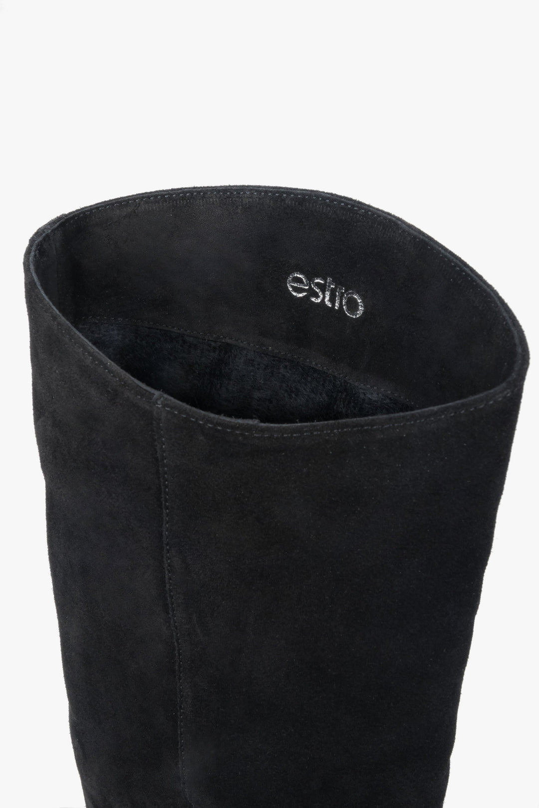 Black women’s knee-high boots made of natural velour on a low heel – details.