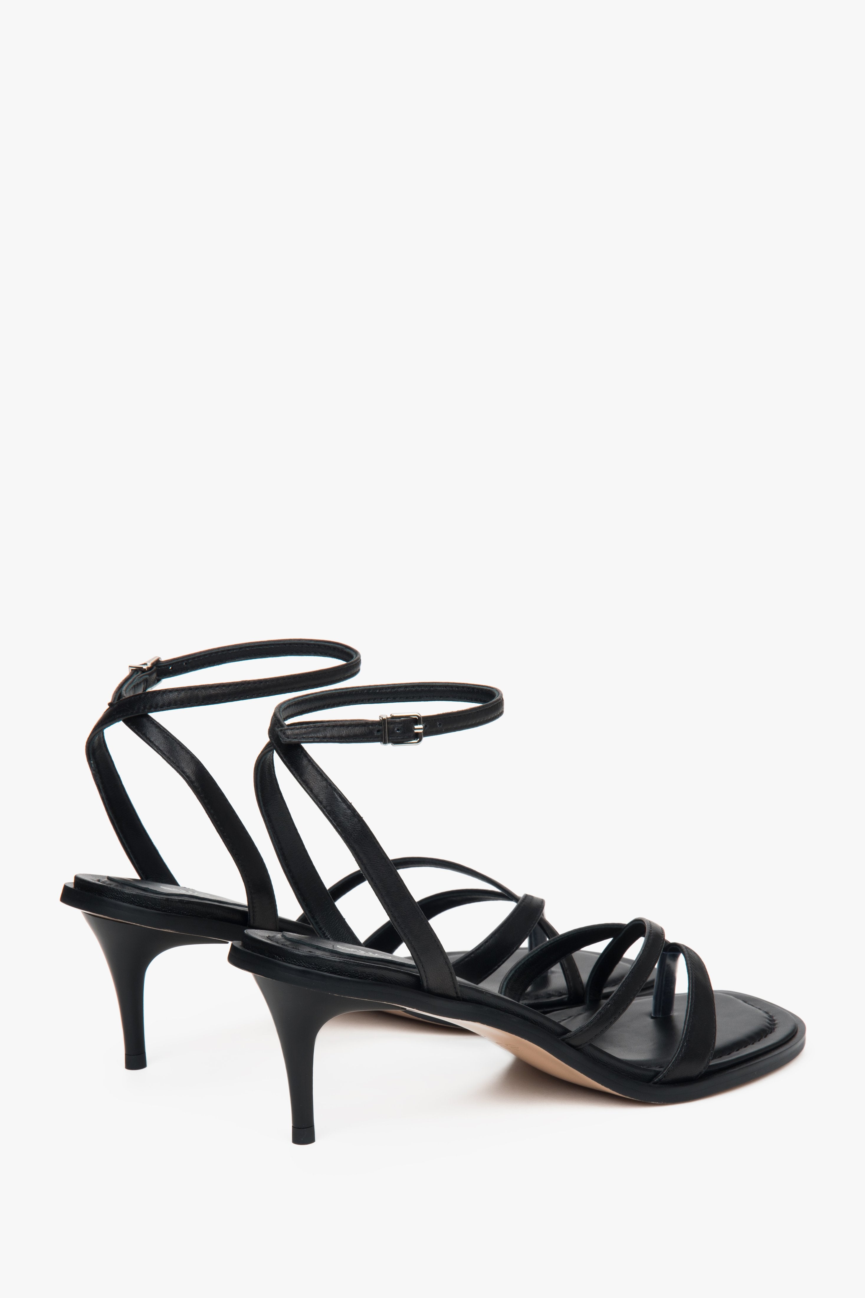In genuine leather, black women’s low-heel sandals by Estro.