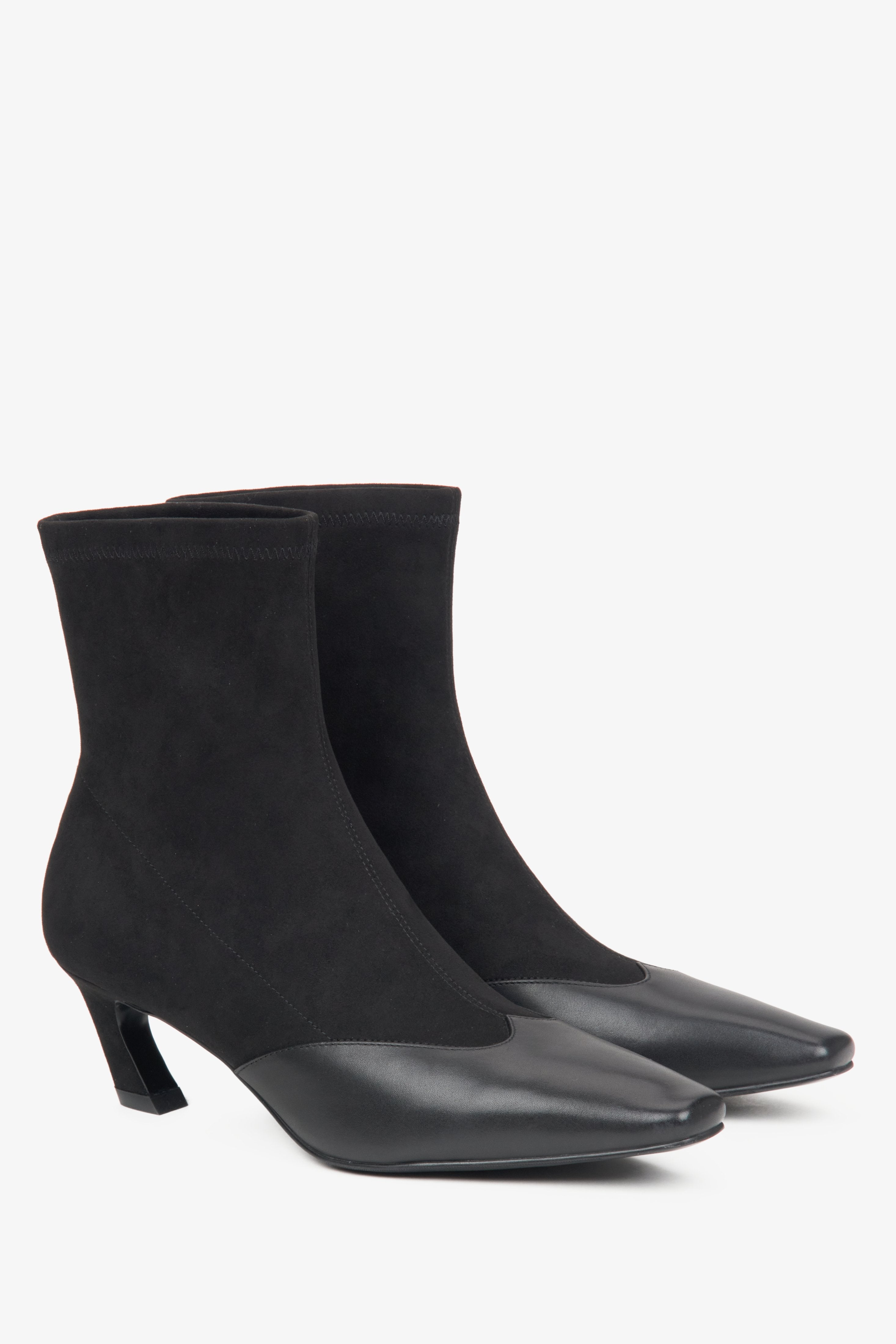 Women's black ankle boots by Estro, crafted from soft textiles and leather with a low heel.