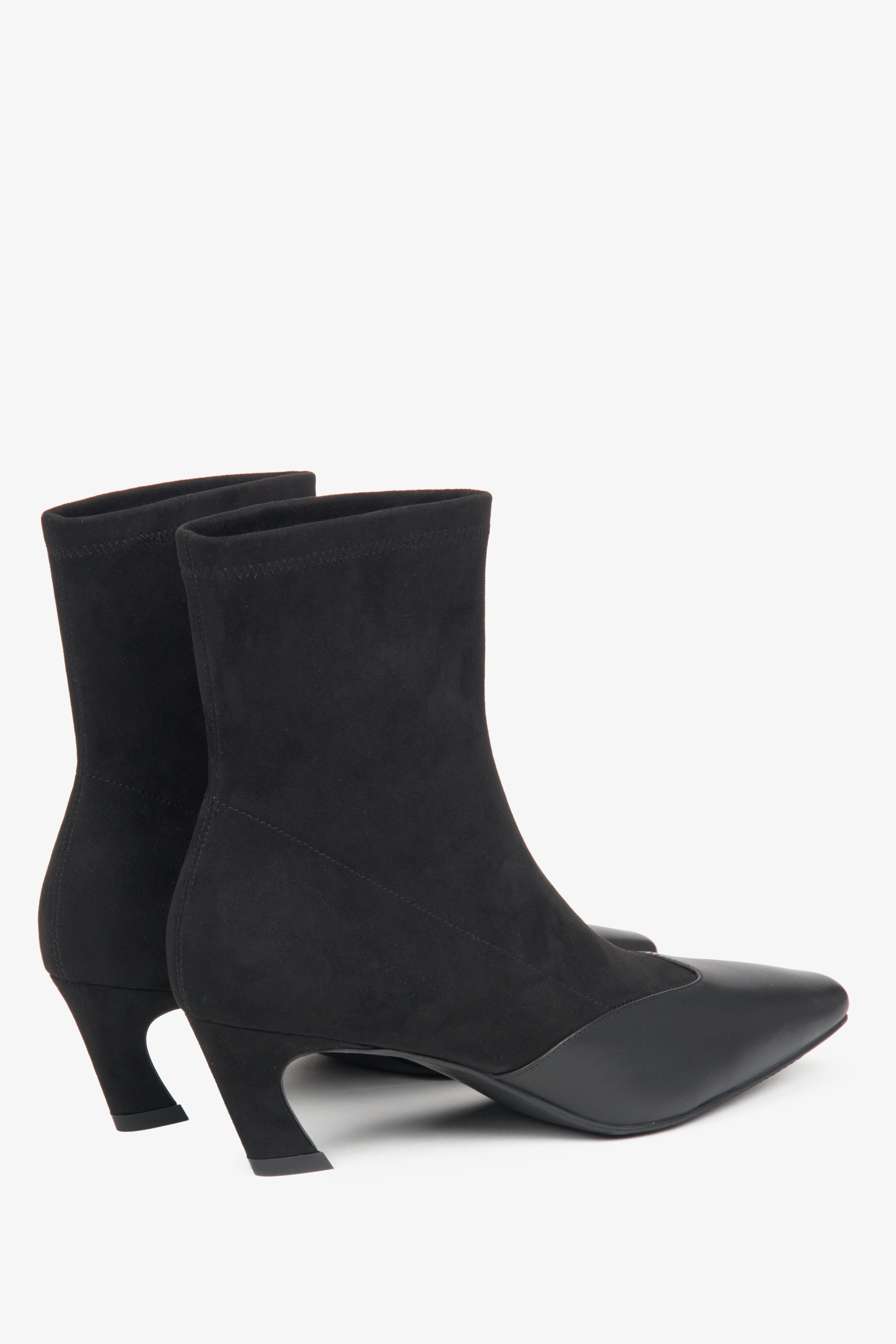 Stylish women's black ankle boots crafted from leather and soft textiles with a low heel by Estro.