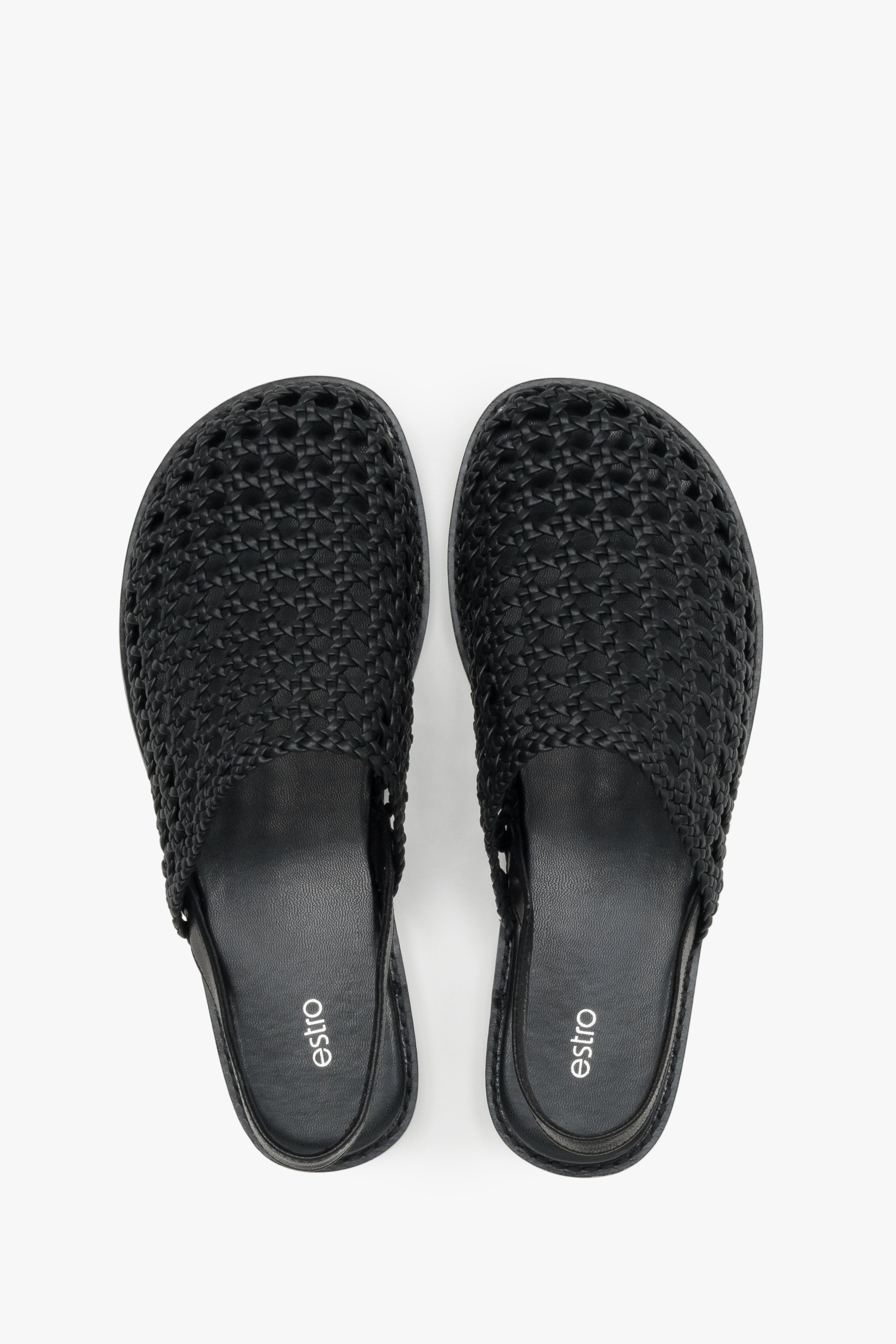 Women's flat leather sandals with a breathable openwork weave.