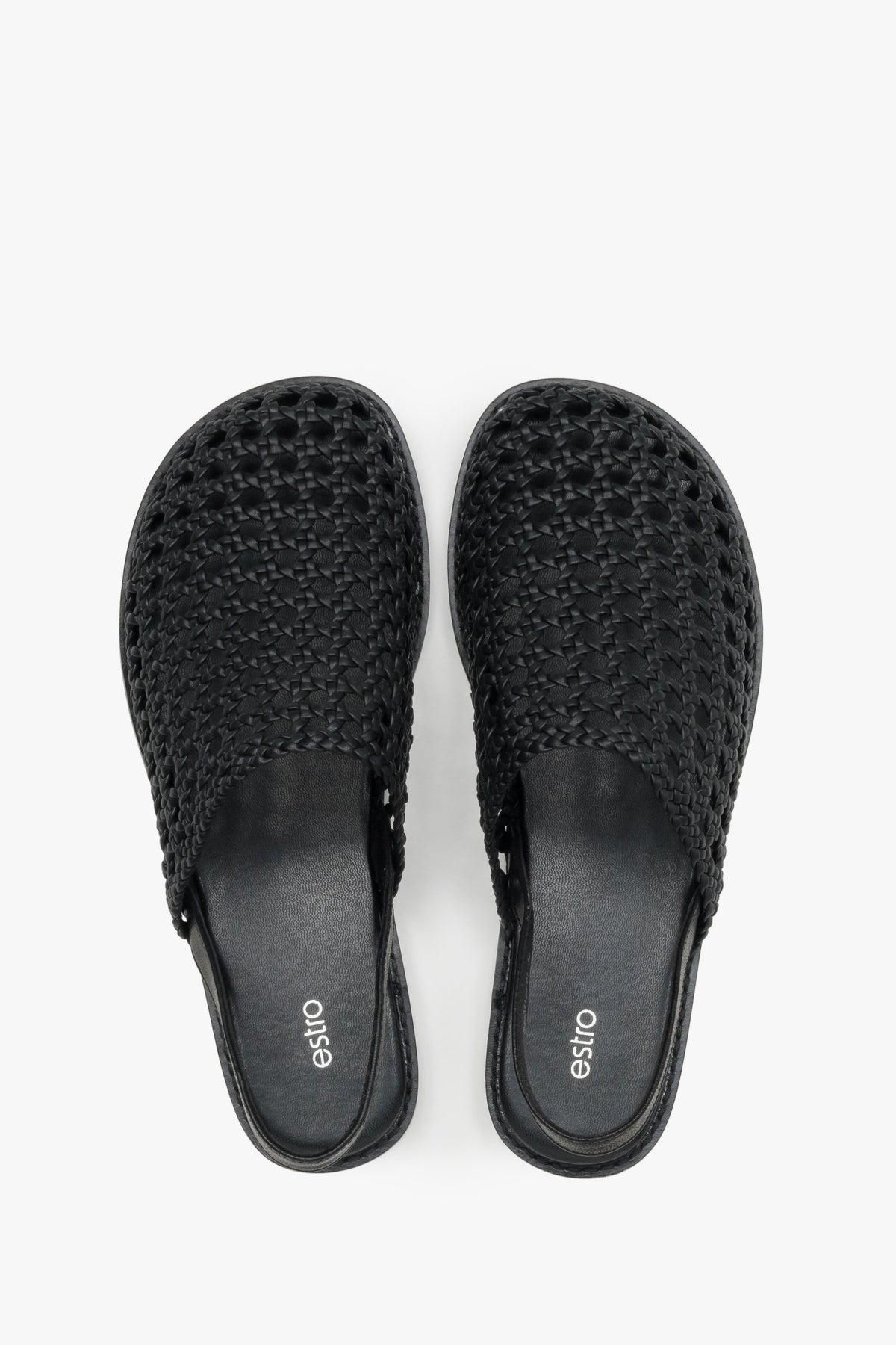 Women's flat leather sandals with a breathable openwork weave.
