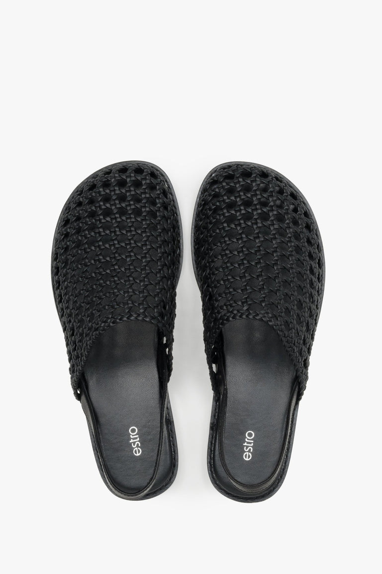 Women's flat leather sandals with a breathable openwork weave.