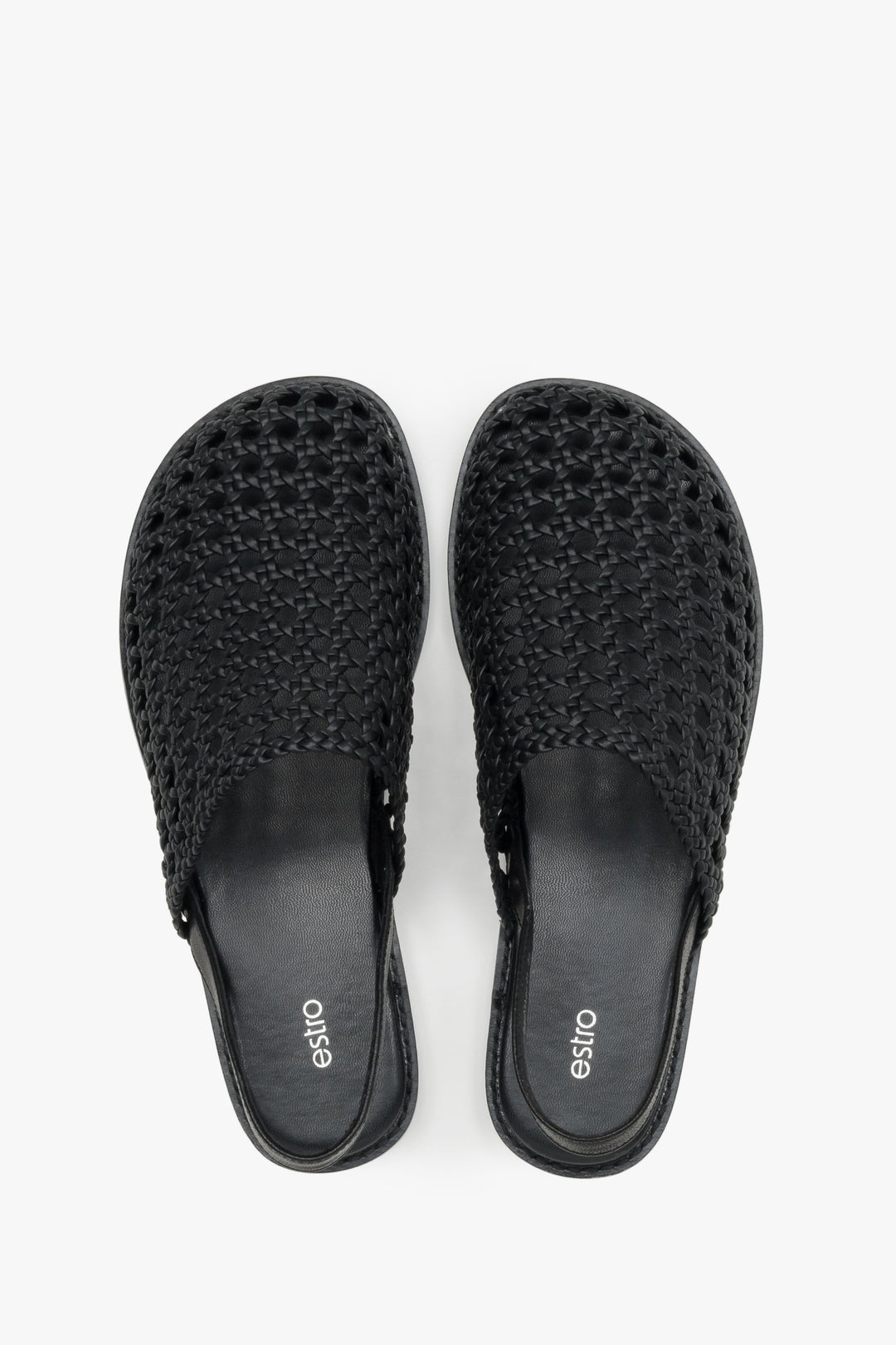Women's flat leather sandals with a breathable openwork weave.