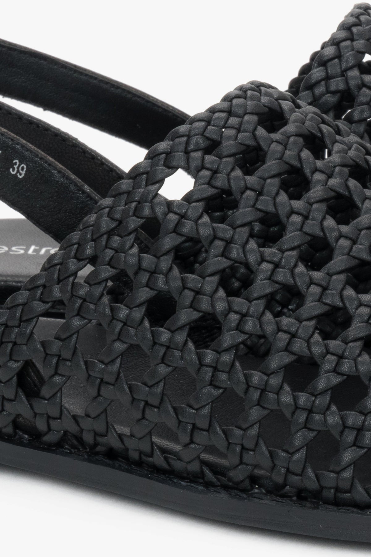 Genuine leather black sandals with an intricate woven upper.