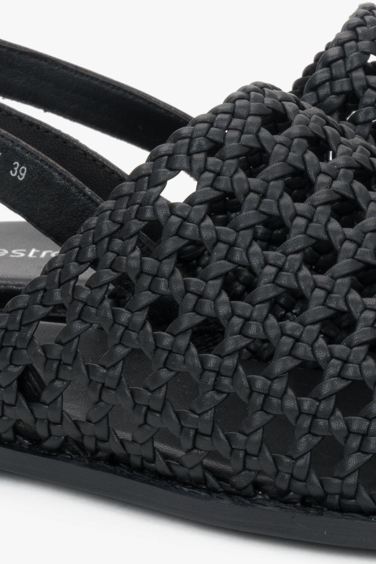 Genuine leather black sandals with an intricate woven upper.
