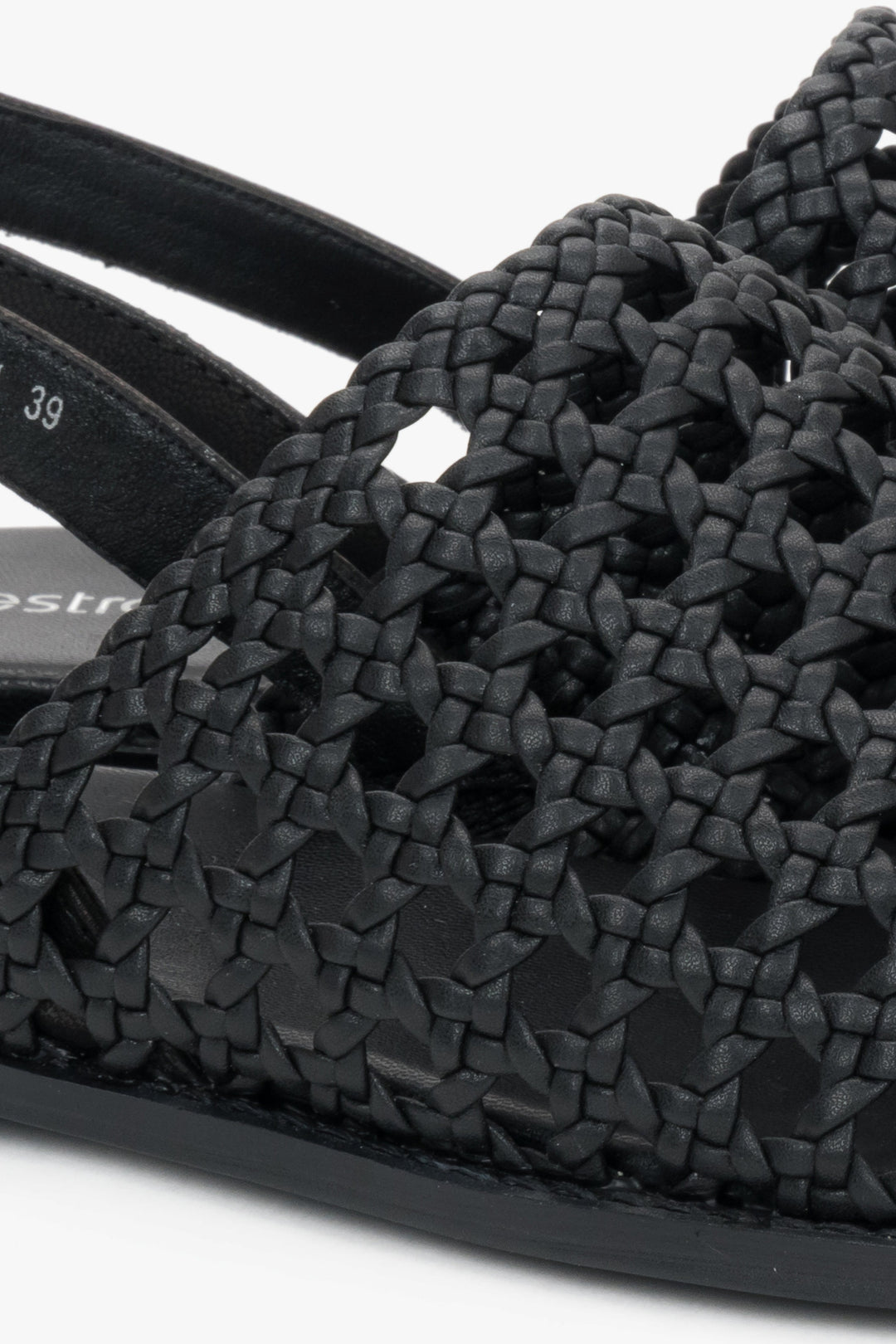 Genuine leather black sandals with an intricate woven upper.