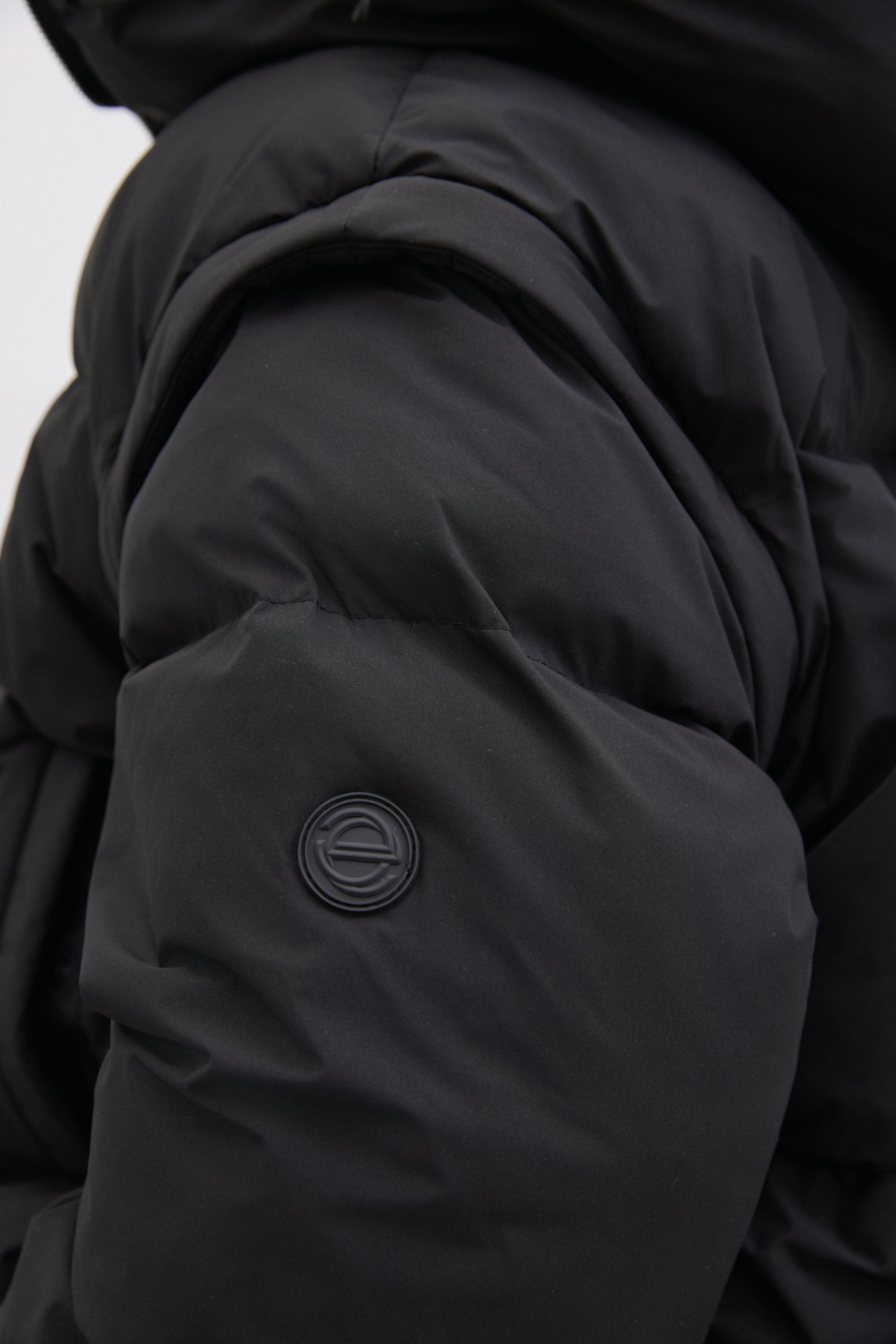 Fashionable Black Women's Oversized Jacket with Removable Sleeves.
