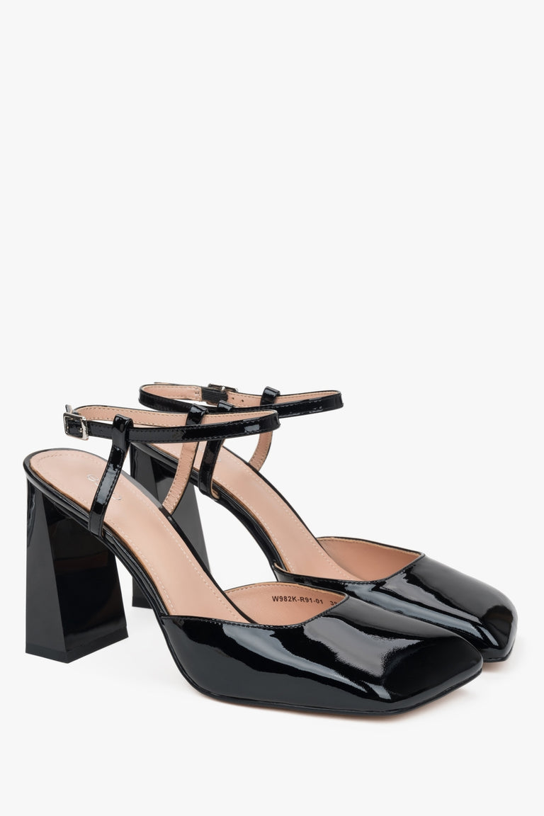 Women’s black block heel sandals in patent leather.