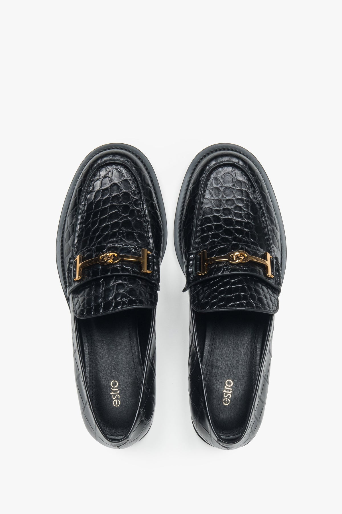 Women’s loafers Estro, black, made of patent natural leather, with a decorative buckle.