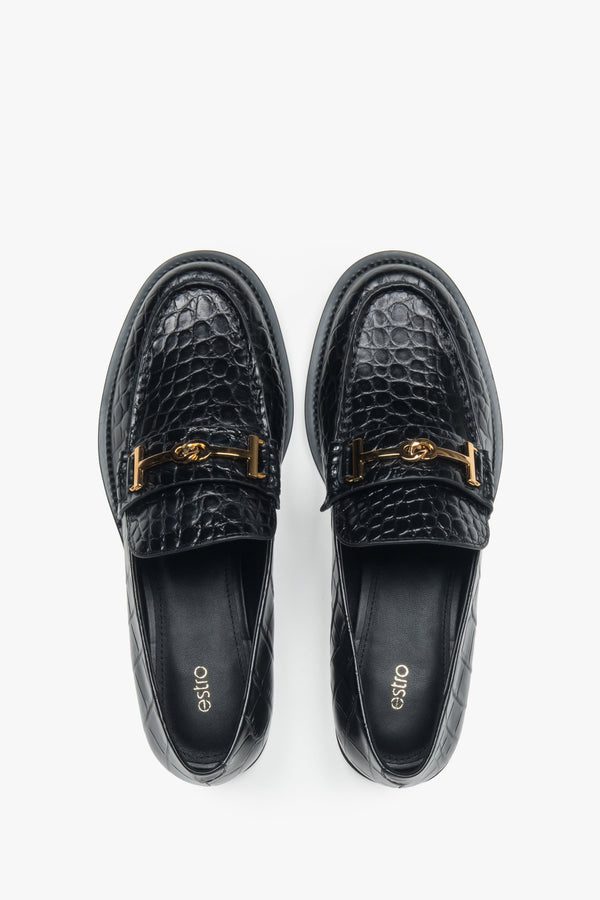 Women’s loafers Estro, black, made of patent natural leather, with a decorative buckle.