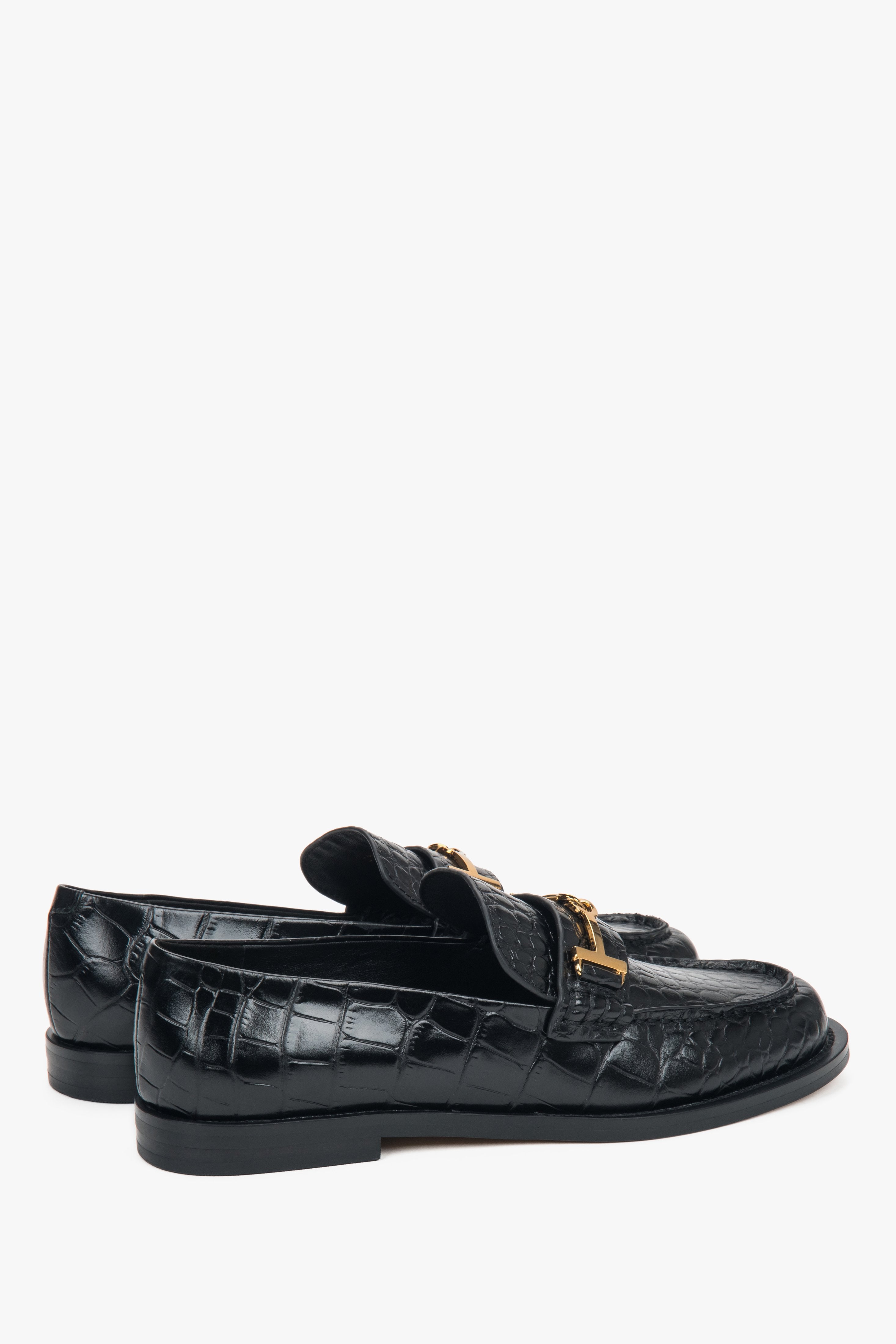 Black women’s patent leather loafers with a decorative buckle Estro.